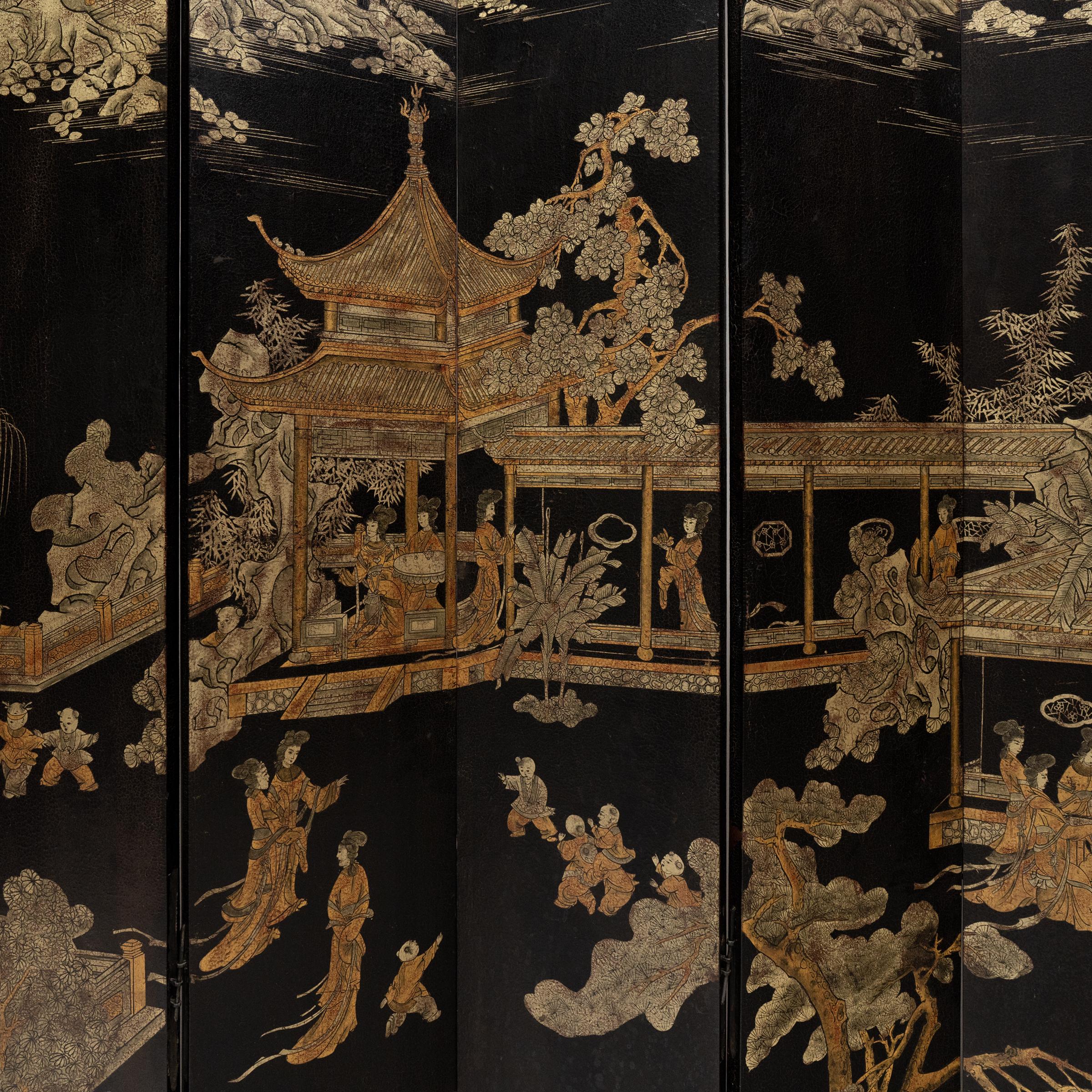 This show-stopping twelve-panel folding screen exemplifies the beauty and opulence of Qing-dynasty design. Dated to the early 20th century, the grand screen is lavishly decorated on both sides with hand-painted gilt pigments atop a coat of black