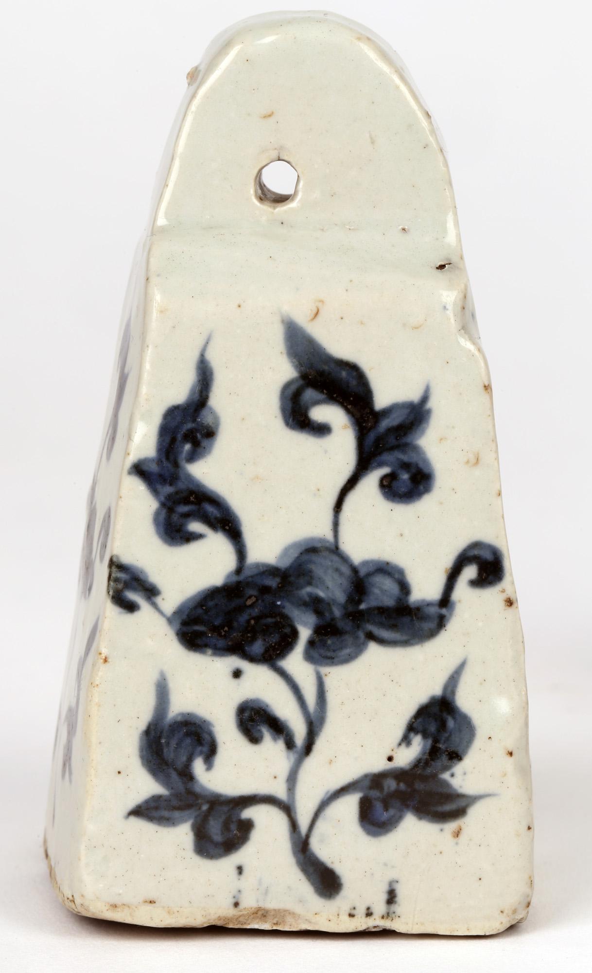Two Chinese Blue & White under glazed porcelain weights in the Yuan (1279-1368) style but probably later. The weights are of tapered square-section shape with a rounded pierced top with a suspension hole. The sides are hand painted with stylized