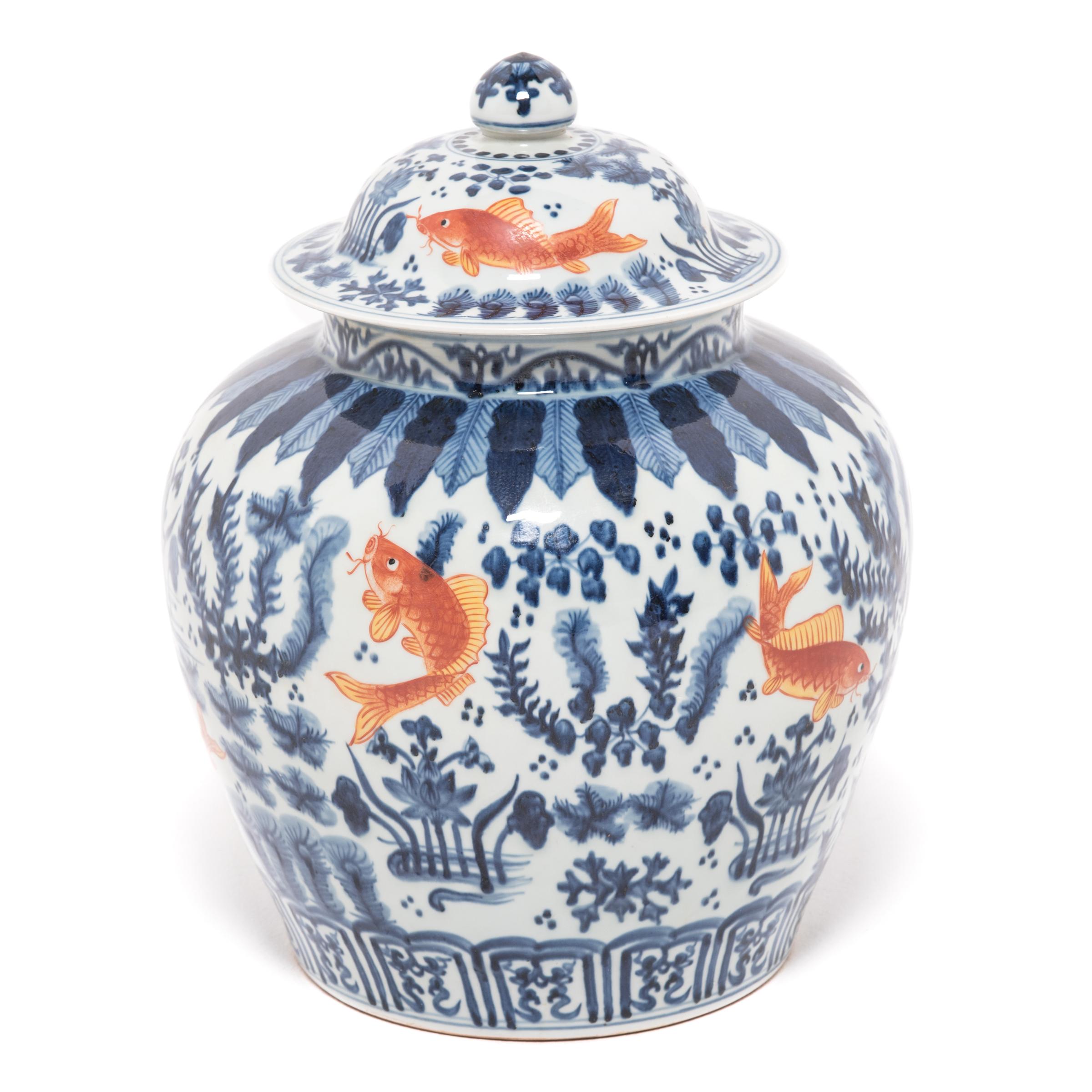 Revered for centuries for its elegant designs of rich cobalt blue and pure white, traditional Chinese blue-and-white porcelain lives on in this covered jar hand painted with fish and flora of the sea, traditional symbols of prosperity and harmony.