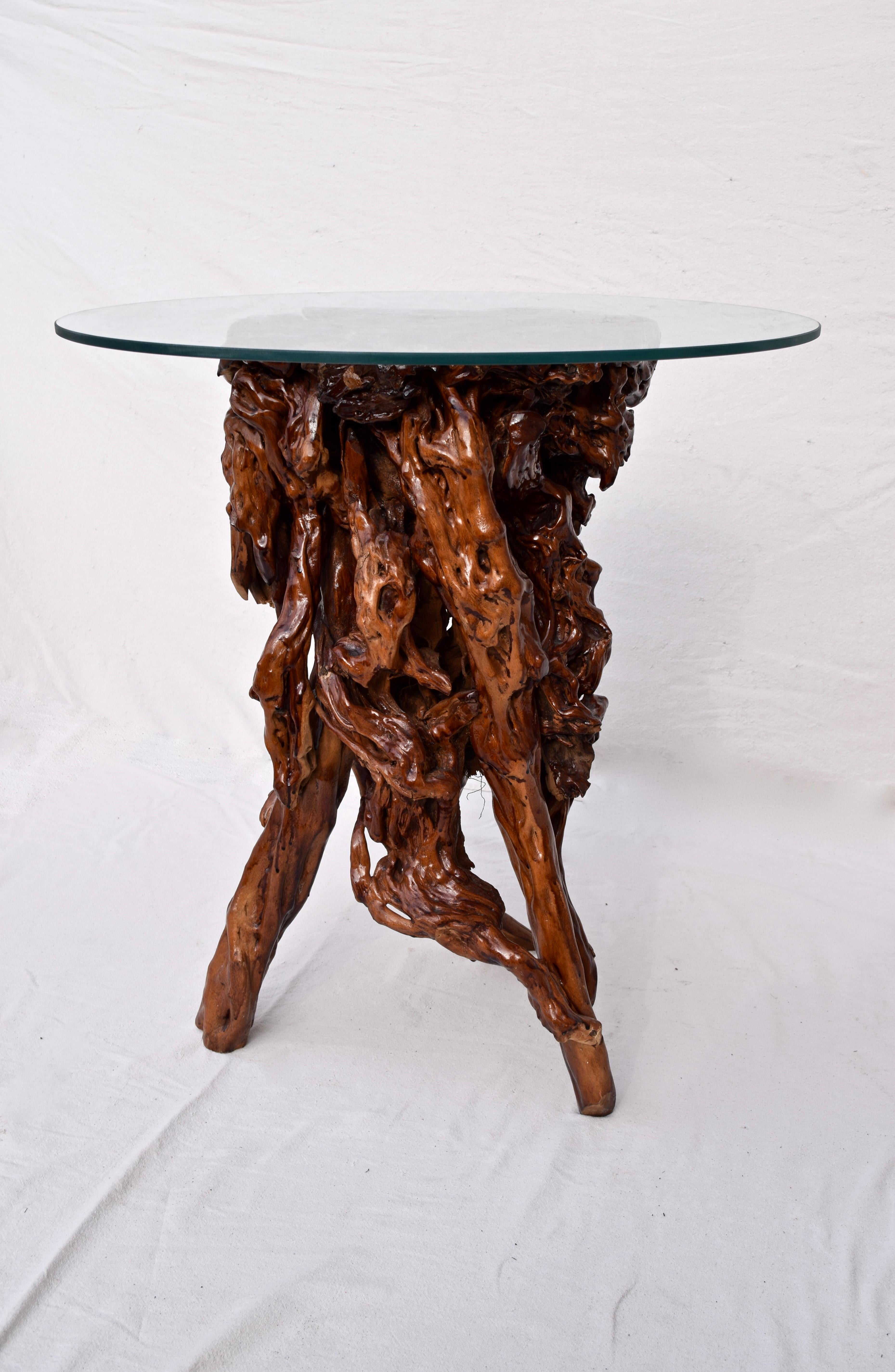 Very old lacquered Chinese root system of sculptural organic form with circular glass top. Functional & aesthetically pleasing for display or table use. Glass top is 29
