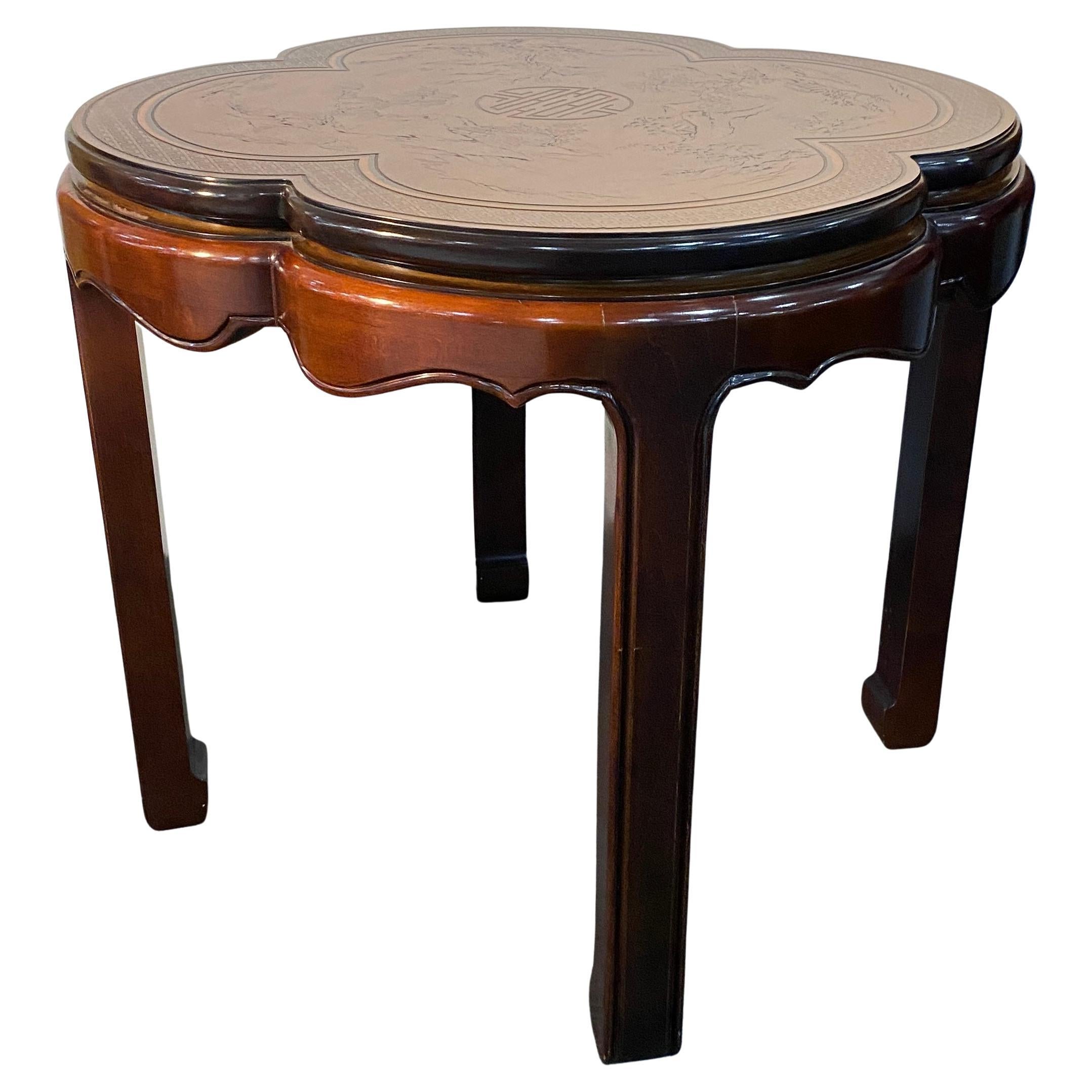 A very good quality Chinese Occasional Table in a somewhat Victorian style. This fine table is constructed of Chinese Elm or Mahogany, both good quality hardwoods. The round or slightly octagonal shape would look perfect placed beside or in front of