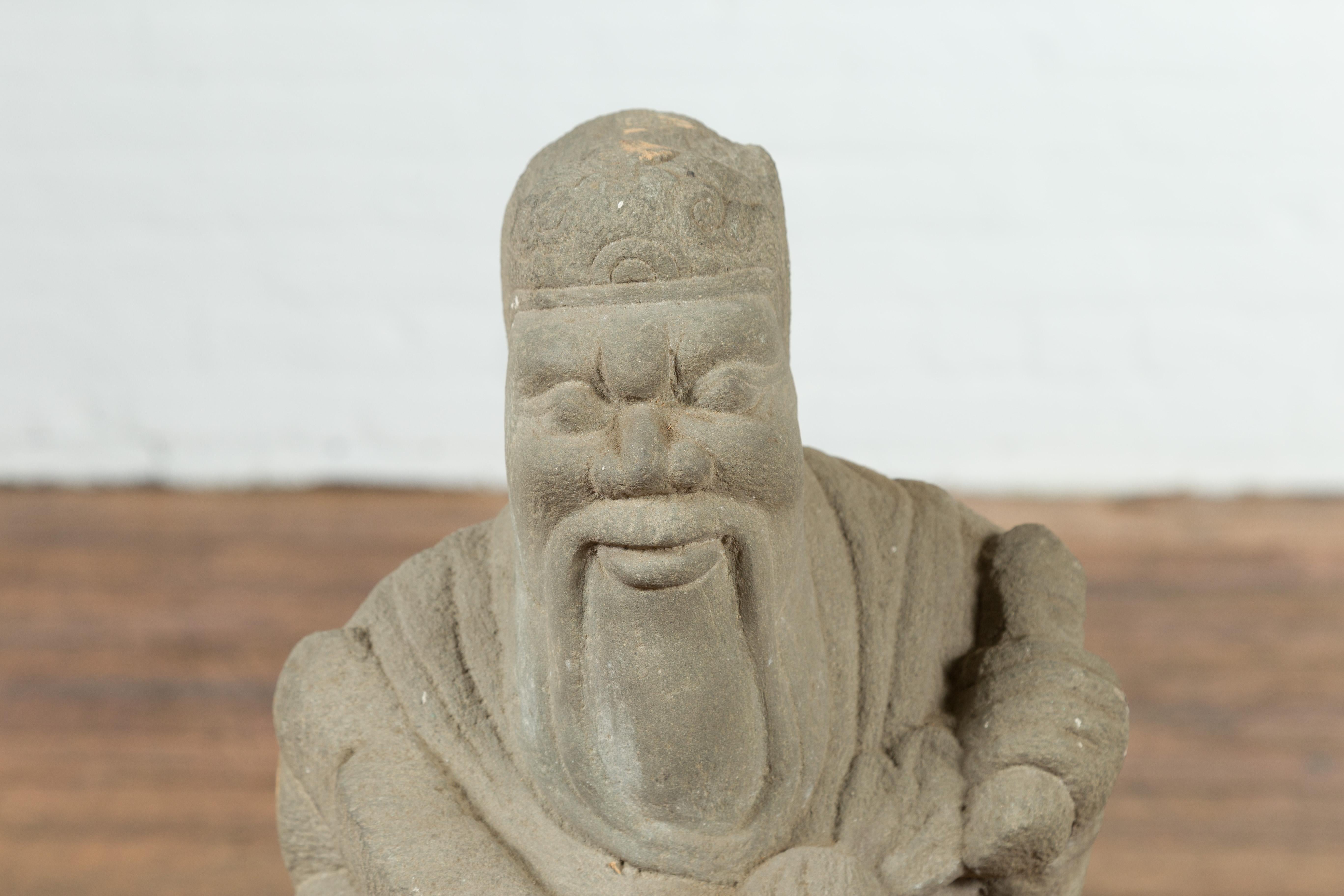 20th Century Chinese Vintage Carved Stone Sculpture Depicting a Seated Monk Holding Objects For Sale