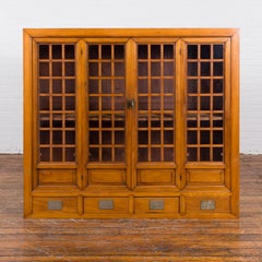 Chinese Vintage Display Cabinet with Paneled Glass Doors and Four Drawers