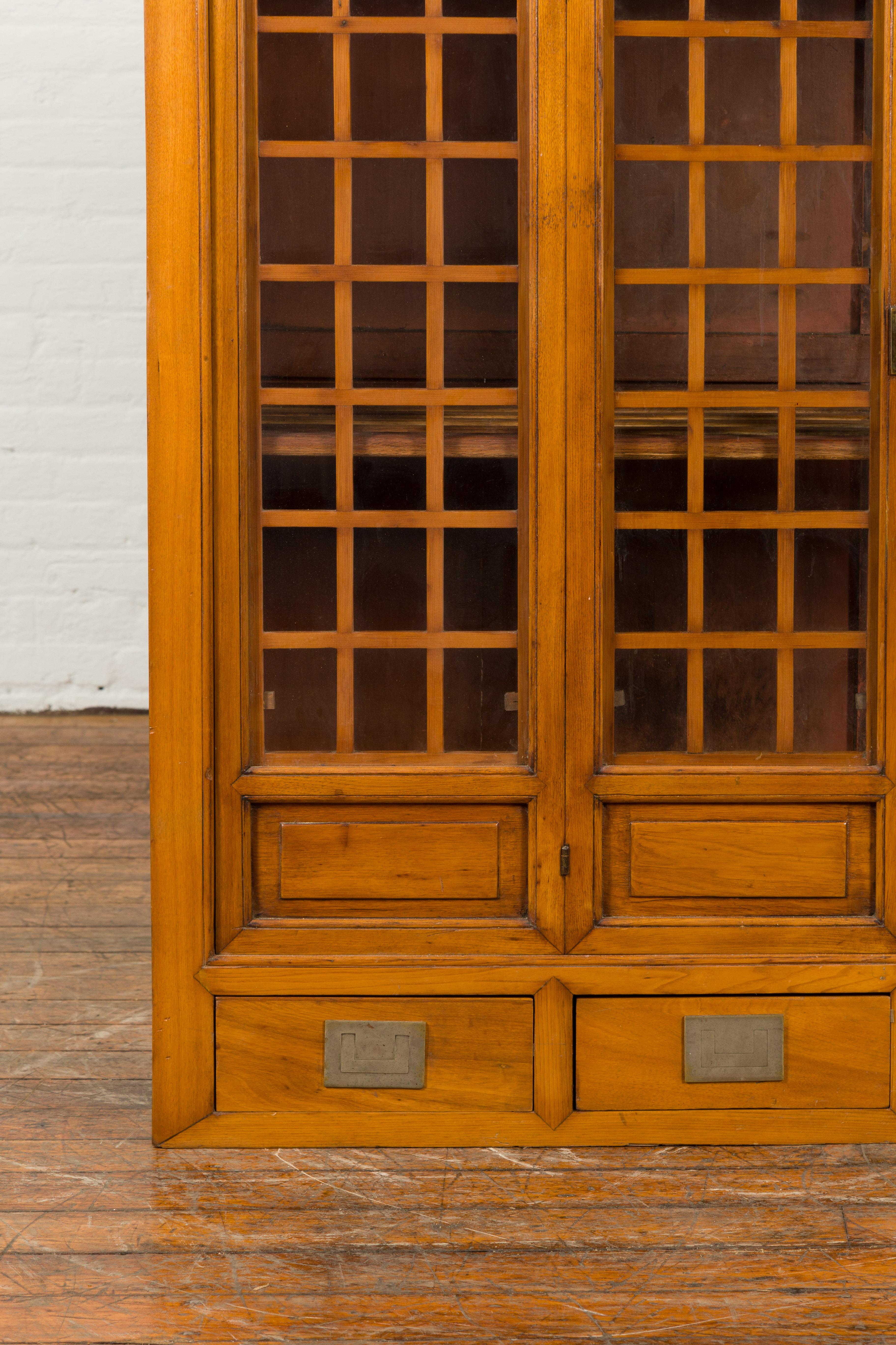 20th Century Chinese Vintage Display Cabinet with Paneled Glass Doors and Four Drawers For Sale