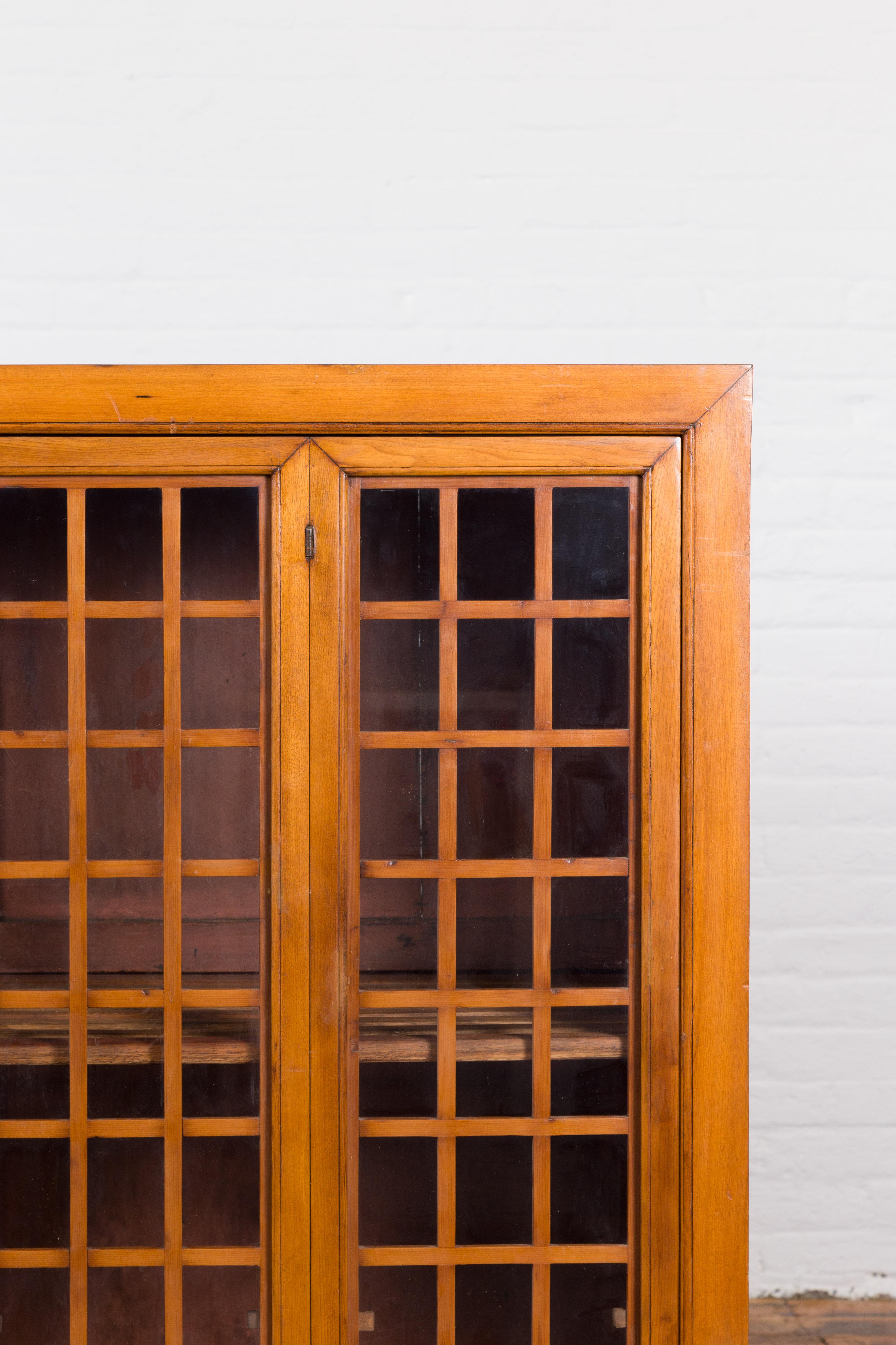 Chinese Vintage Display Cabinet with Paneled Glass Doors and Four Drawers For Sale 1