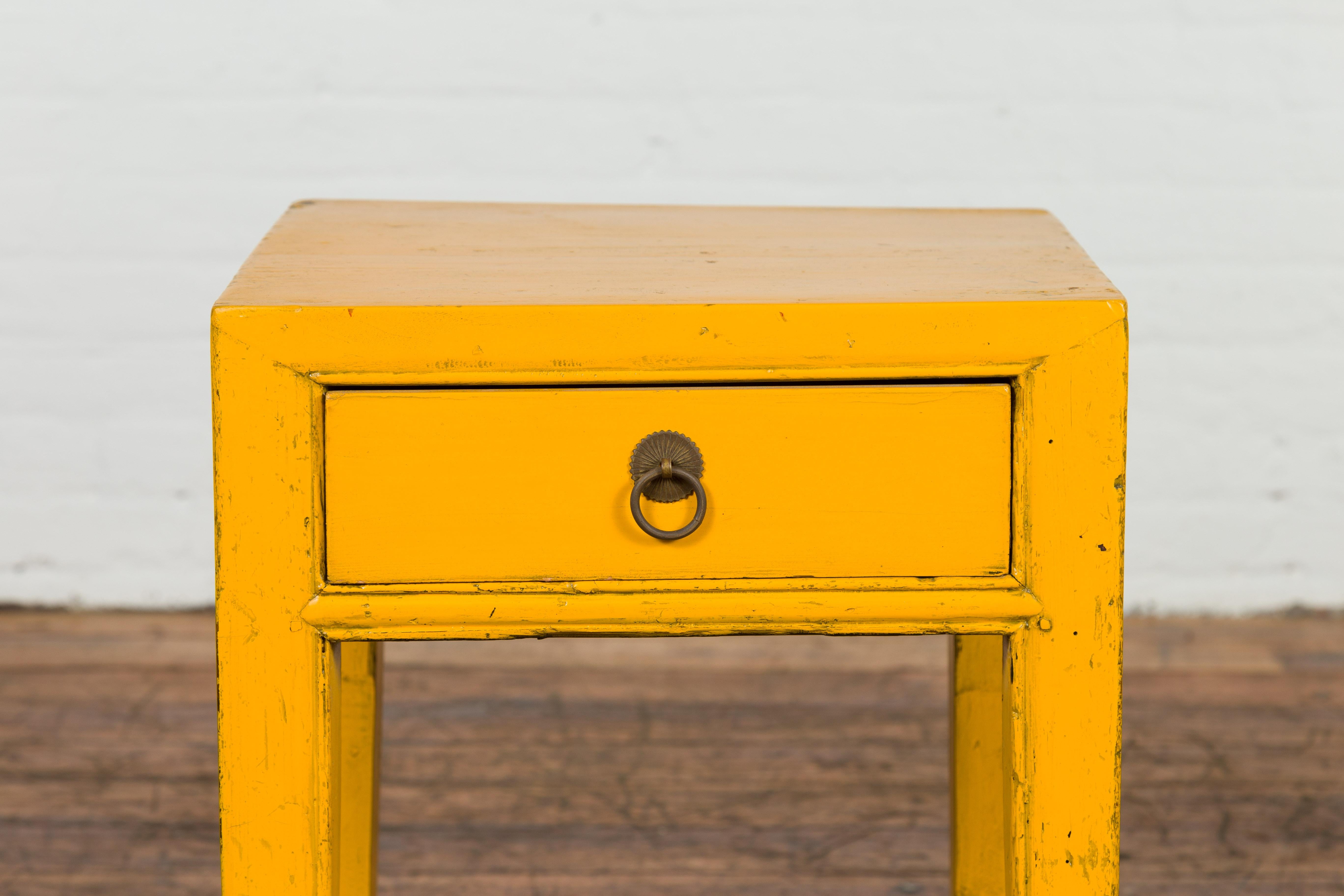 Lacquered Chinese Vintage Distressed Yellow Lacquer with Single Drawer and Horse Hoof Feet For Sale