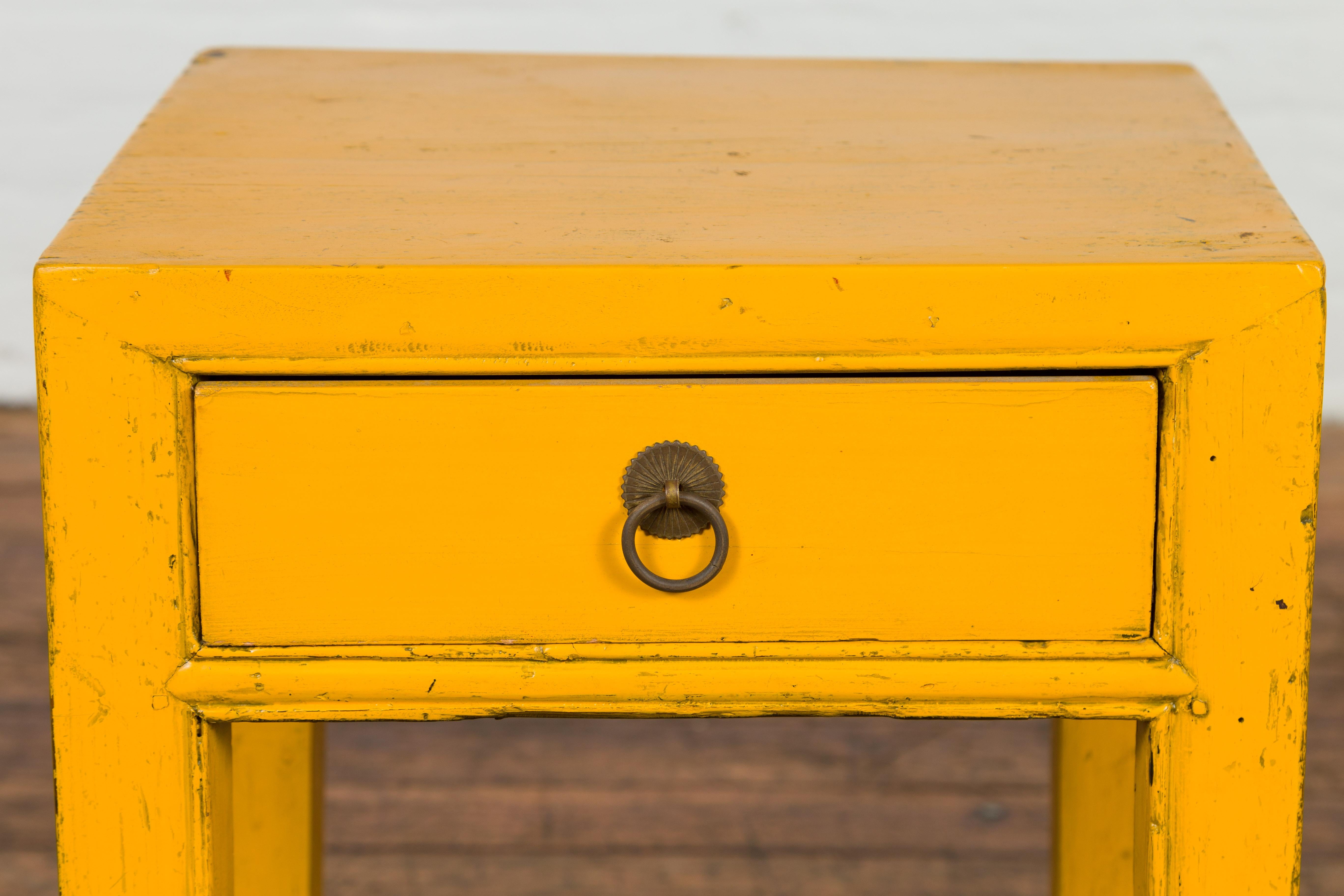 20th Century Chinese Vintage Distressed Yellow Lacquer with Single Drawer and Horse Hoof Feet For Sale