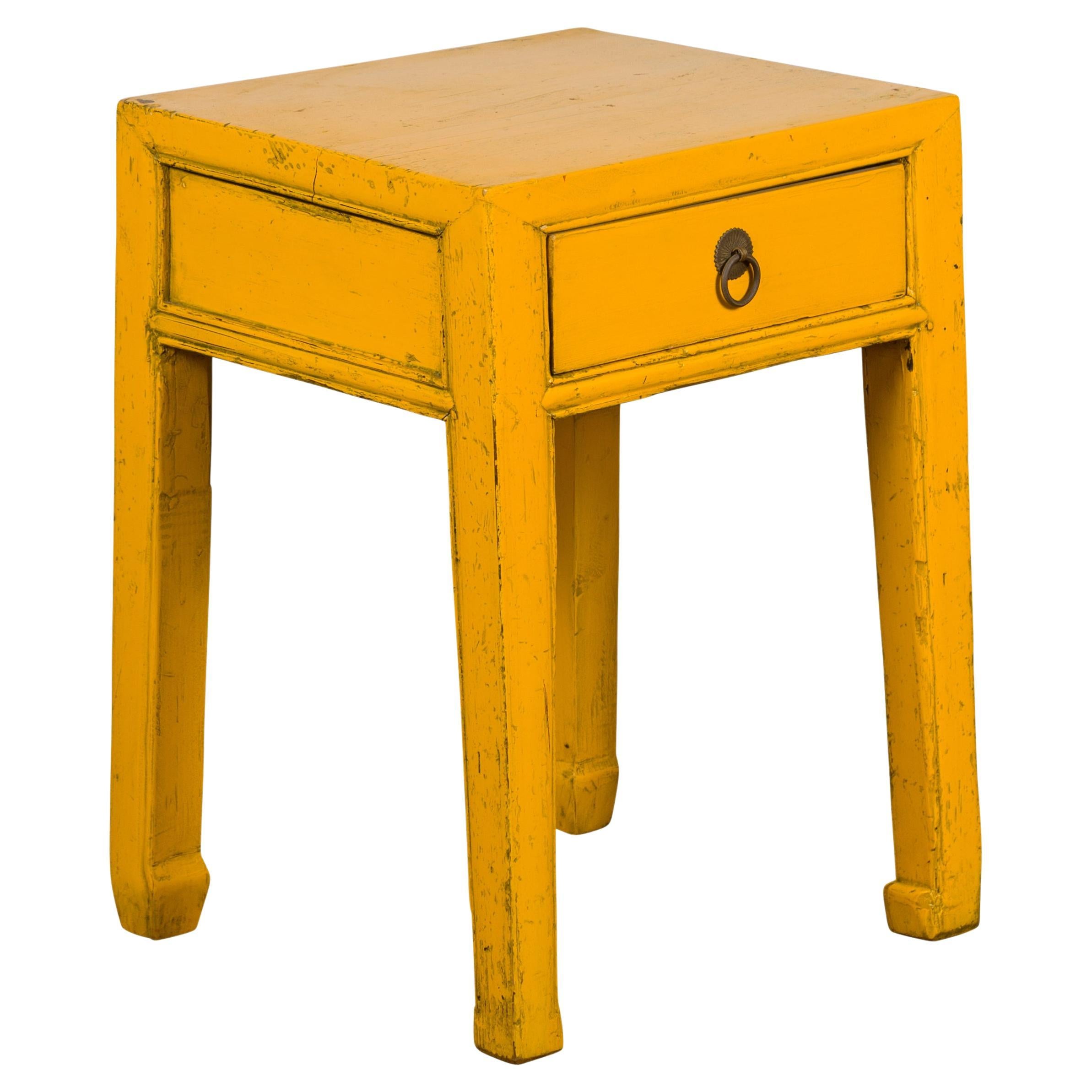 Chinese Vintage Distressed Yellow Lacquer with Single Drawer and Horse Hoof Feet For Sale
