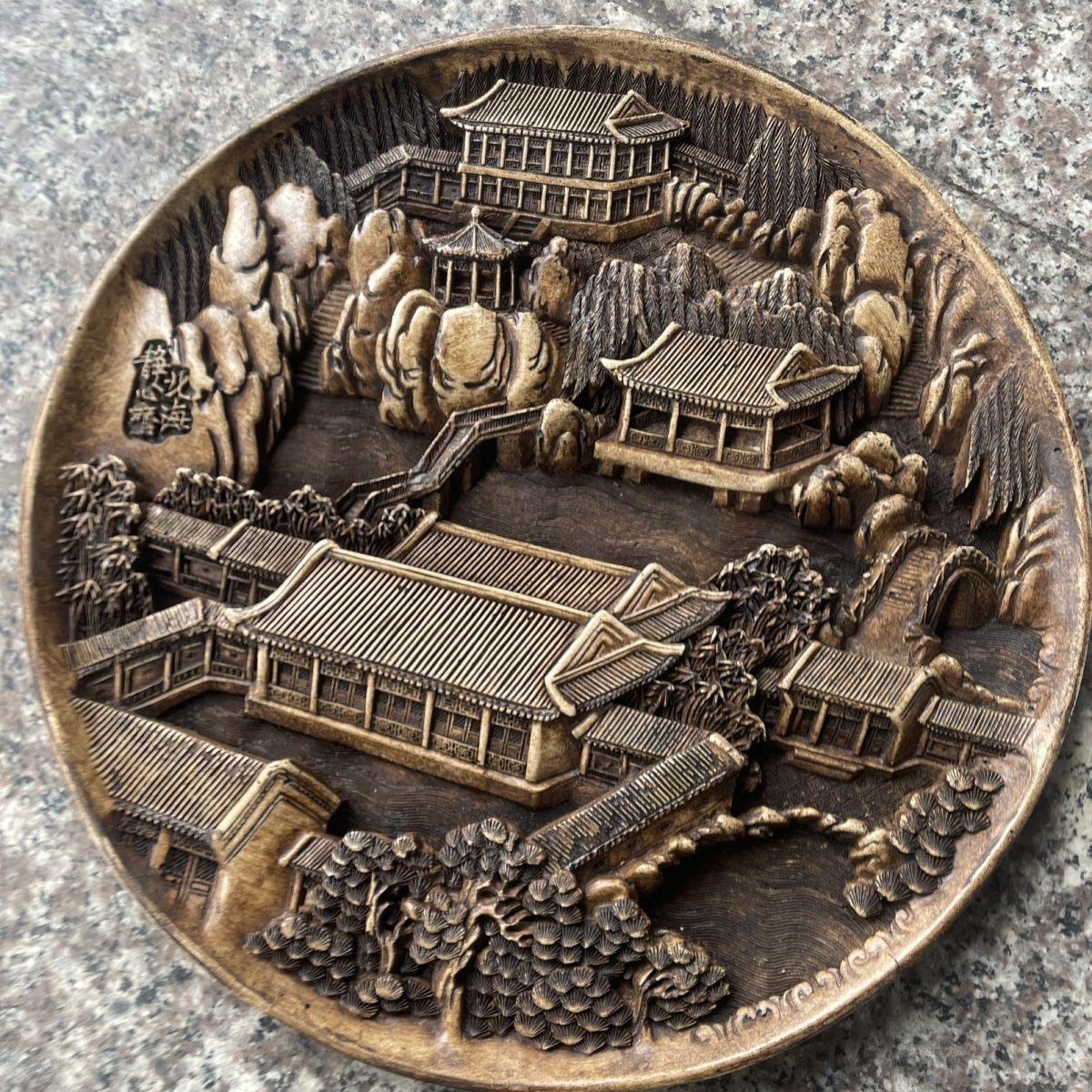 A beautifully carved, wonderfully crafted stone landscape and buildings plate.

The plate is engraving from natural stone clearly by a master of his Craft (the Chinese artifacts collector we acquired this from could not remember the artist's name