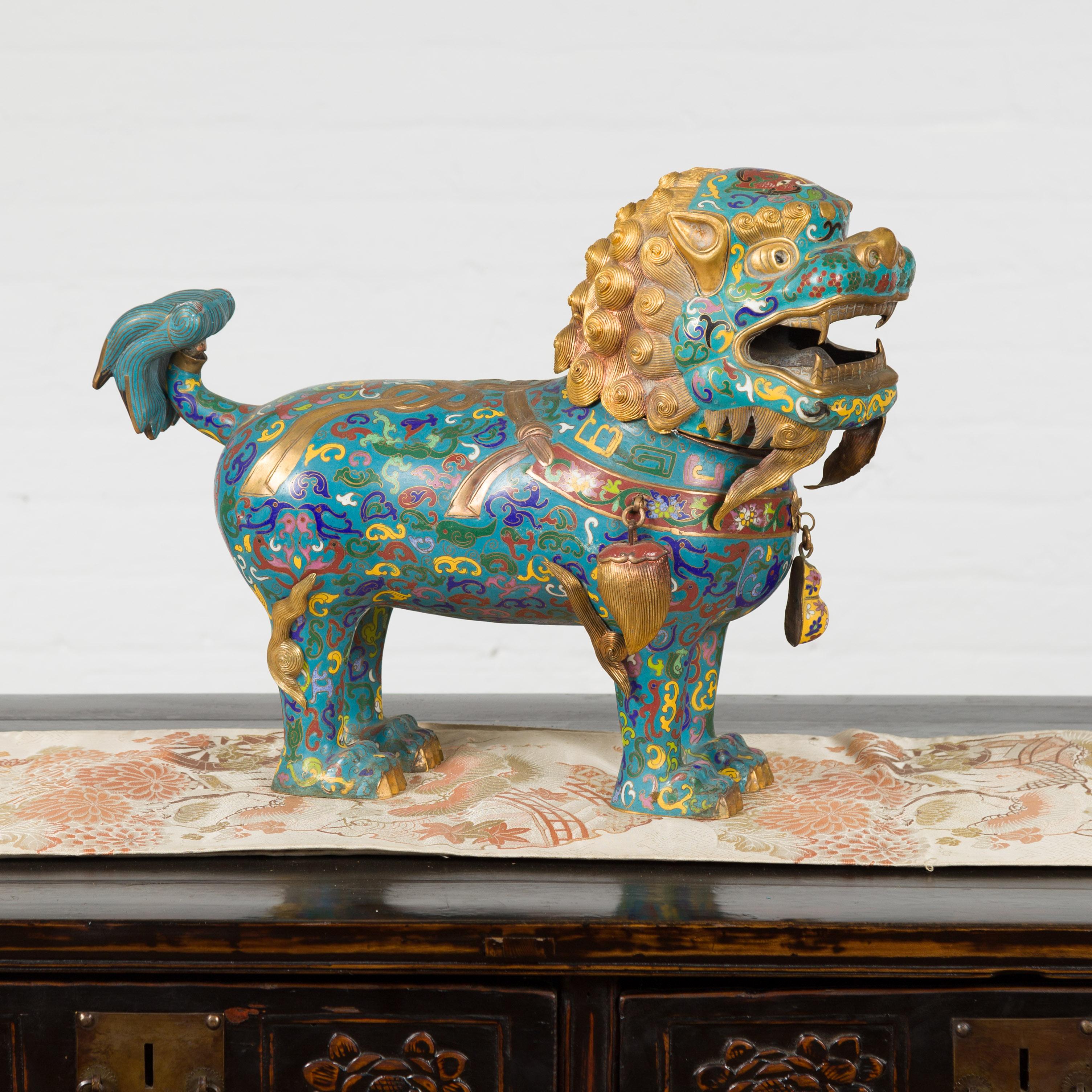 A Chinese vintage metal cloisonné foo dog guardian lion sculpture from the mid 20th century. We have a pair available, (see item LU863924346582), photographed together on image 3. Created in China during the midcentury period, this metal cloisonné