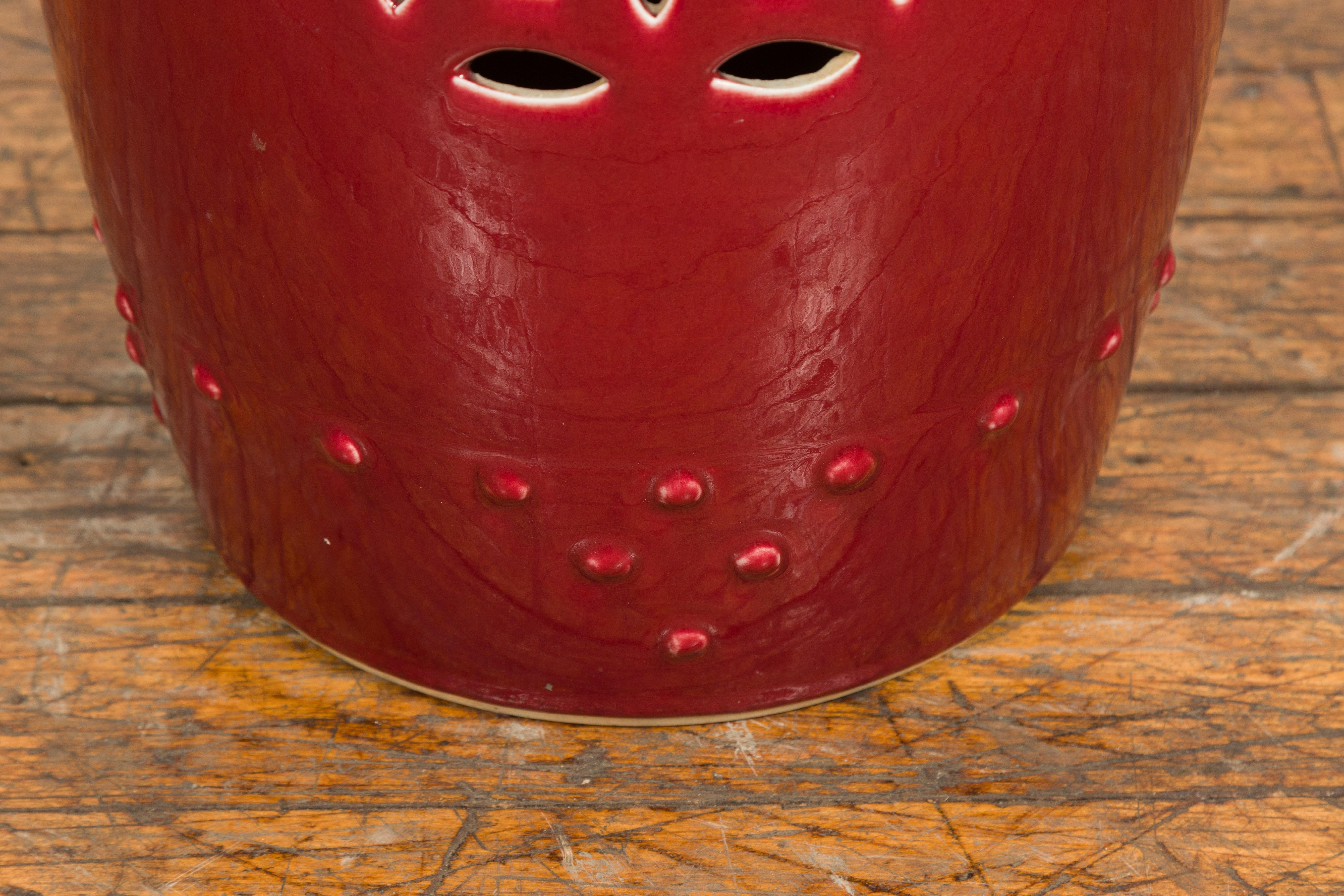 Chinese Vintage Oxblood Glazed Garden Stool with Pierced and Raised Motifs 5