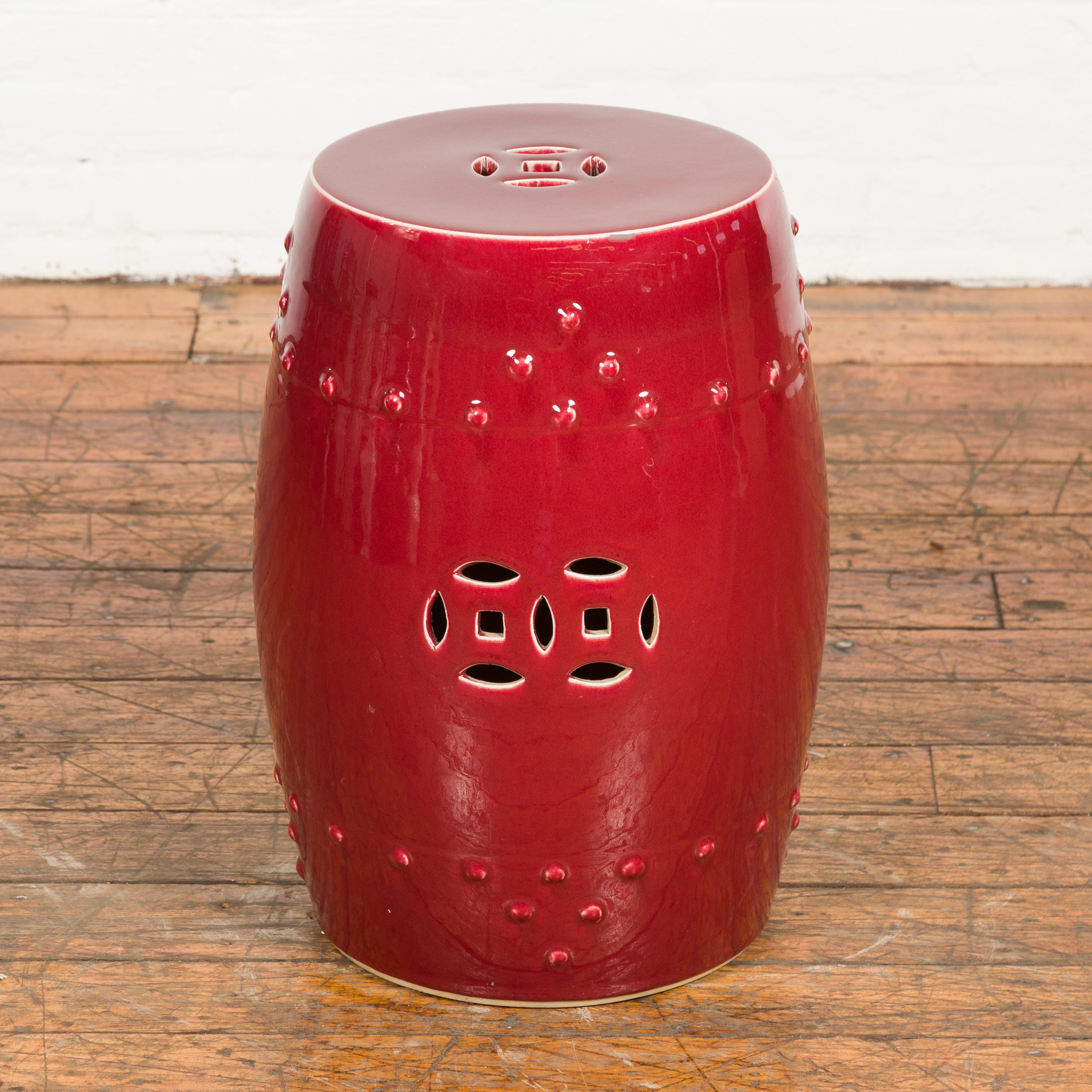 Mid-Century Modern Chinese Vintage Oxblood Glazed Garden Stool with Pierced and Raised Motifs