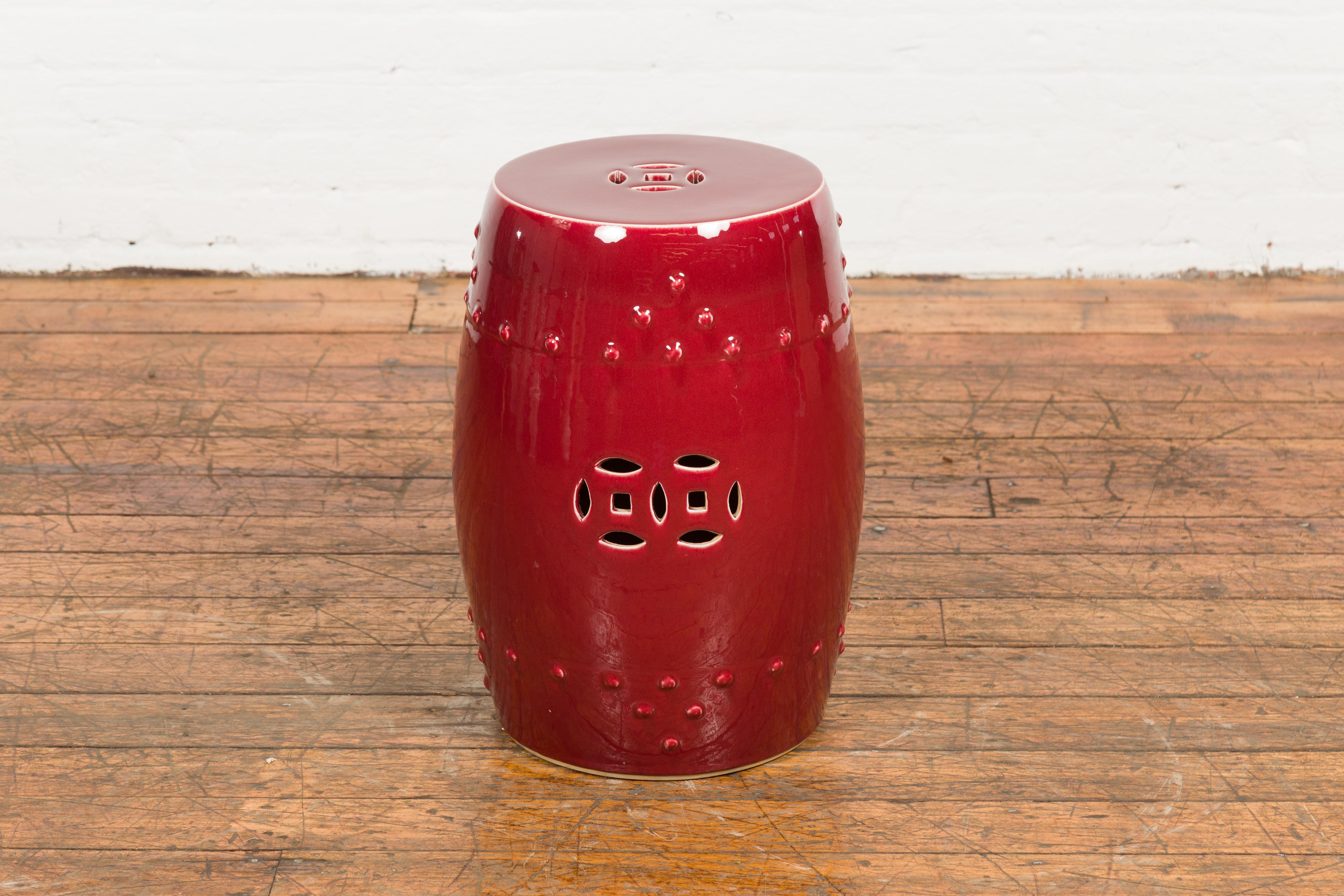 Chinese Vintage Oxblood Glazed Garden Stool with Pierced and Raised Motifs In Good Condition In Yonkers, NY