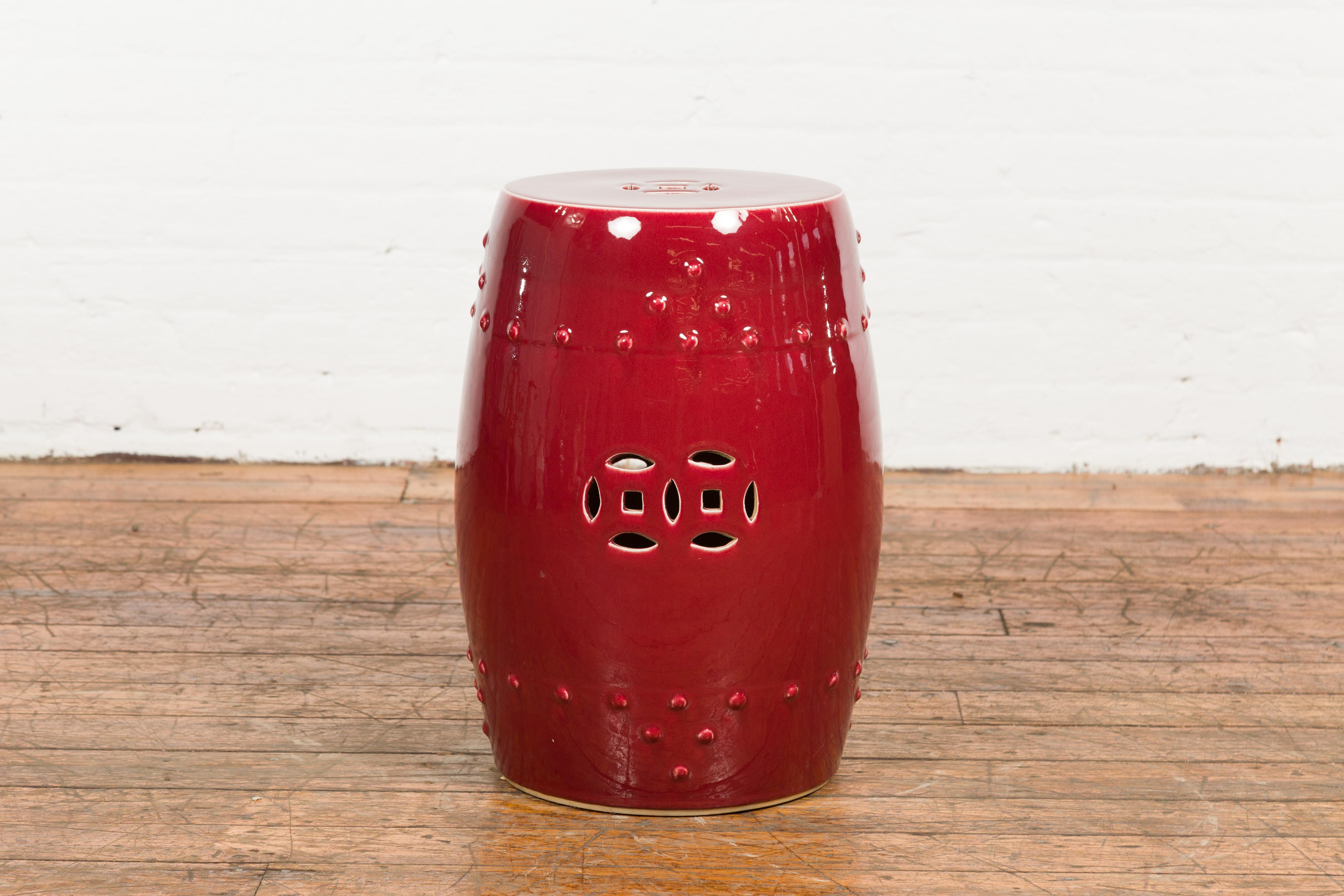 20th Century Chinese Vintage Oxblood Glazed Garden Stool with Pierced and Raised Motifs
