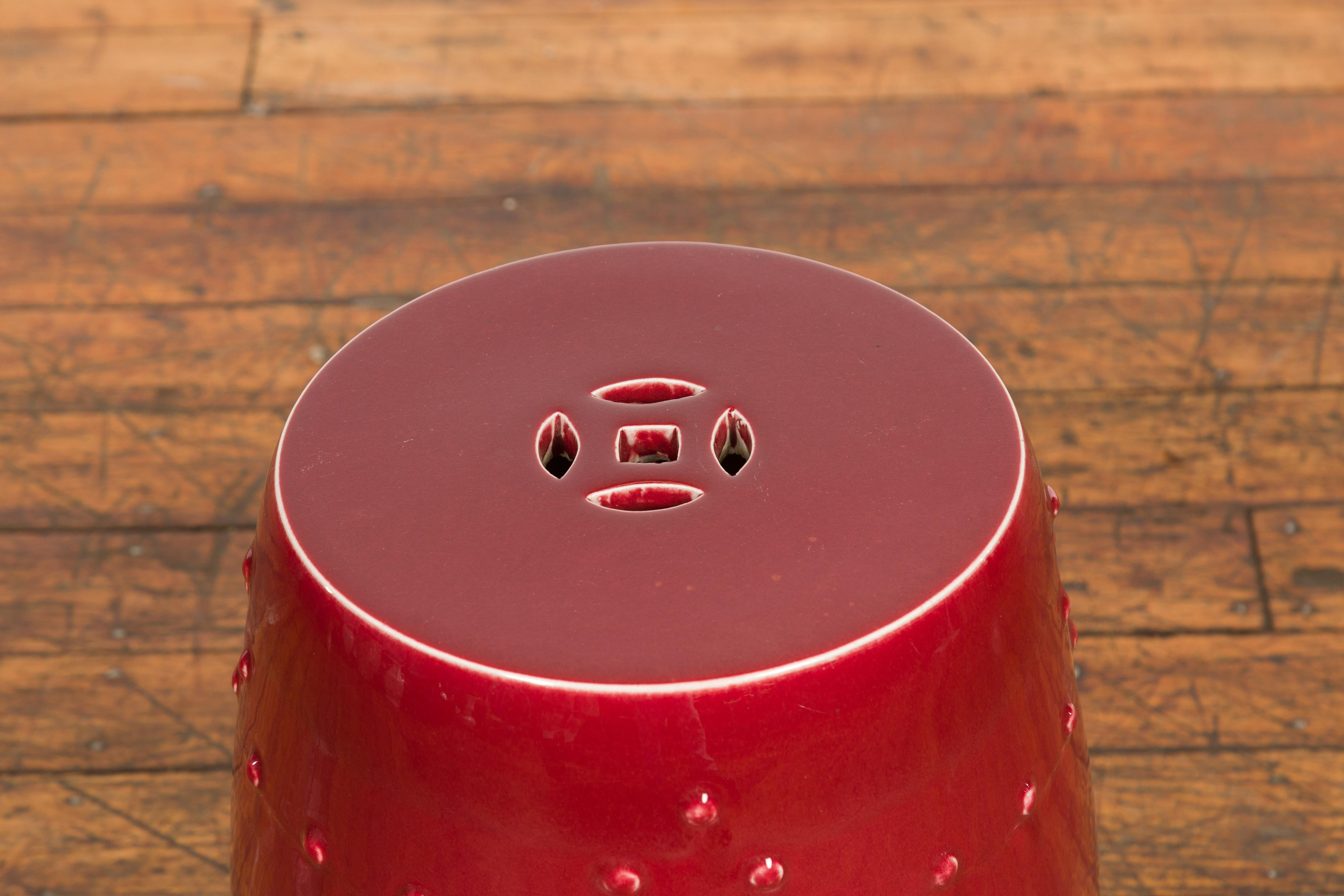 Ceramic Chinese Vintage Oxblood Glazed Garden Stool with Pierced and Raised Motifs