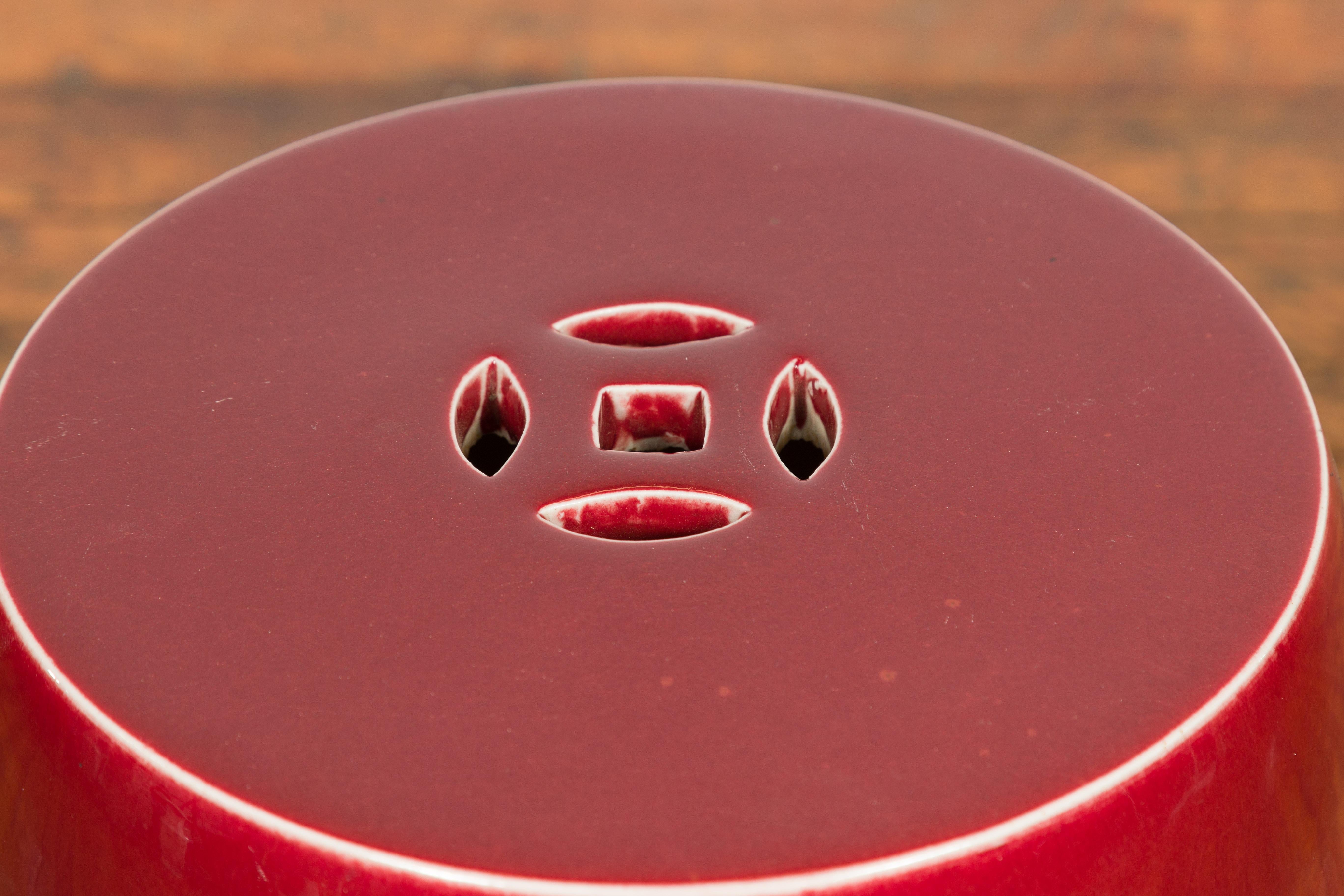 Chinese Vintage Oxblood Glazed Garden Stool with Pierced and Raised Motifs 1
