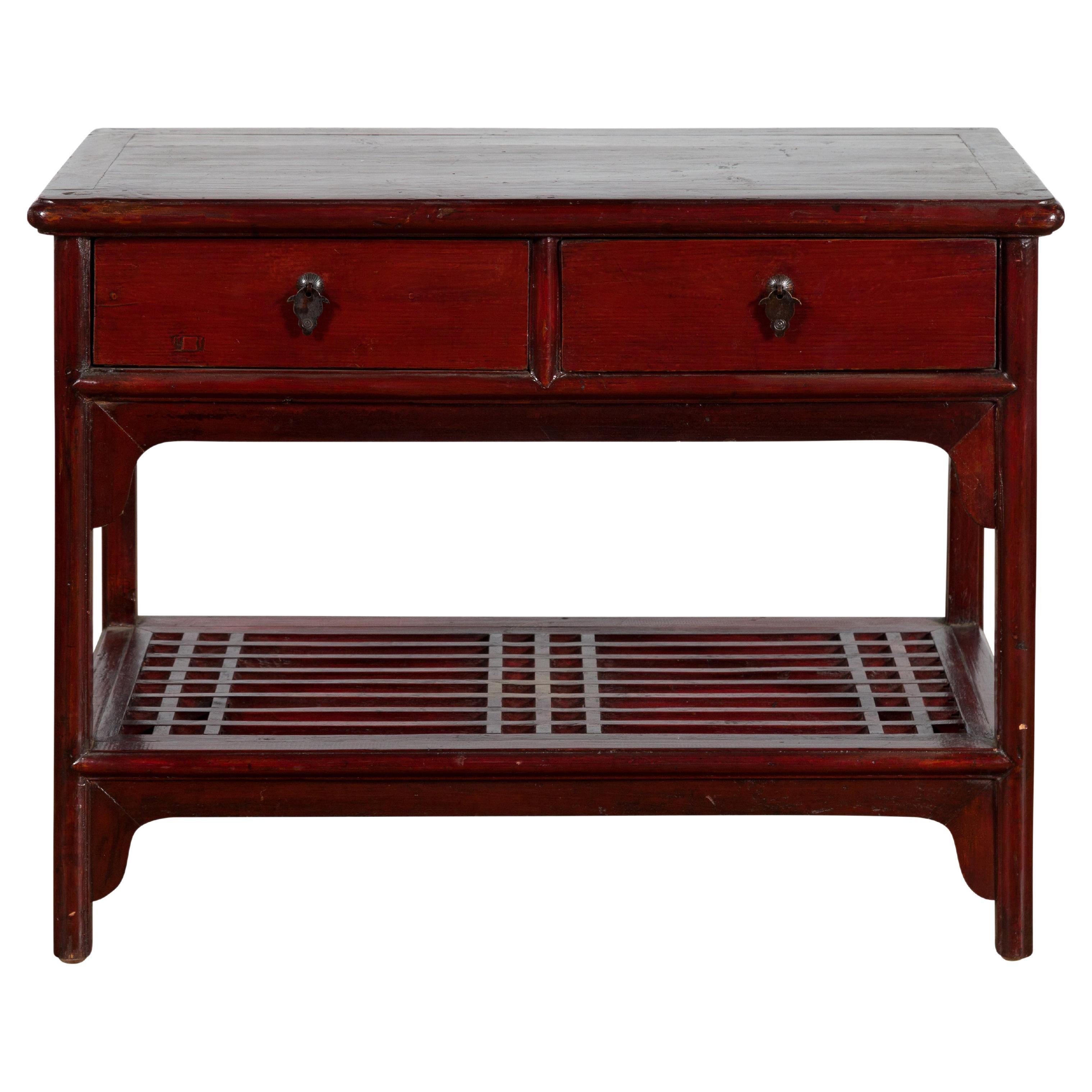 Chinese Vintage Oxblood Lacquer Side Table with Two Drawers and Fretwork Shelf For Sale