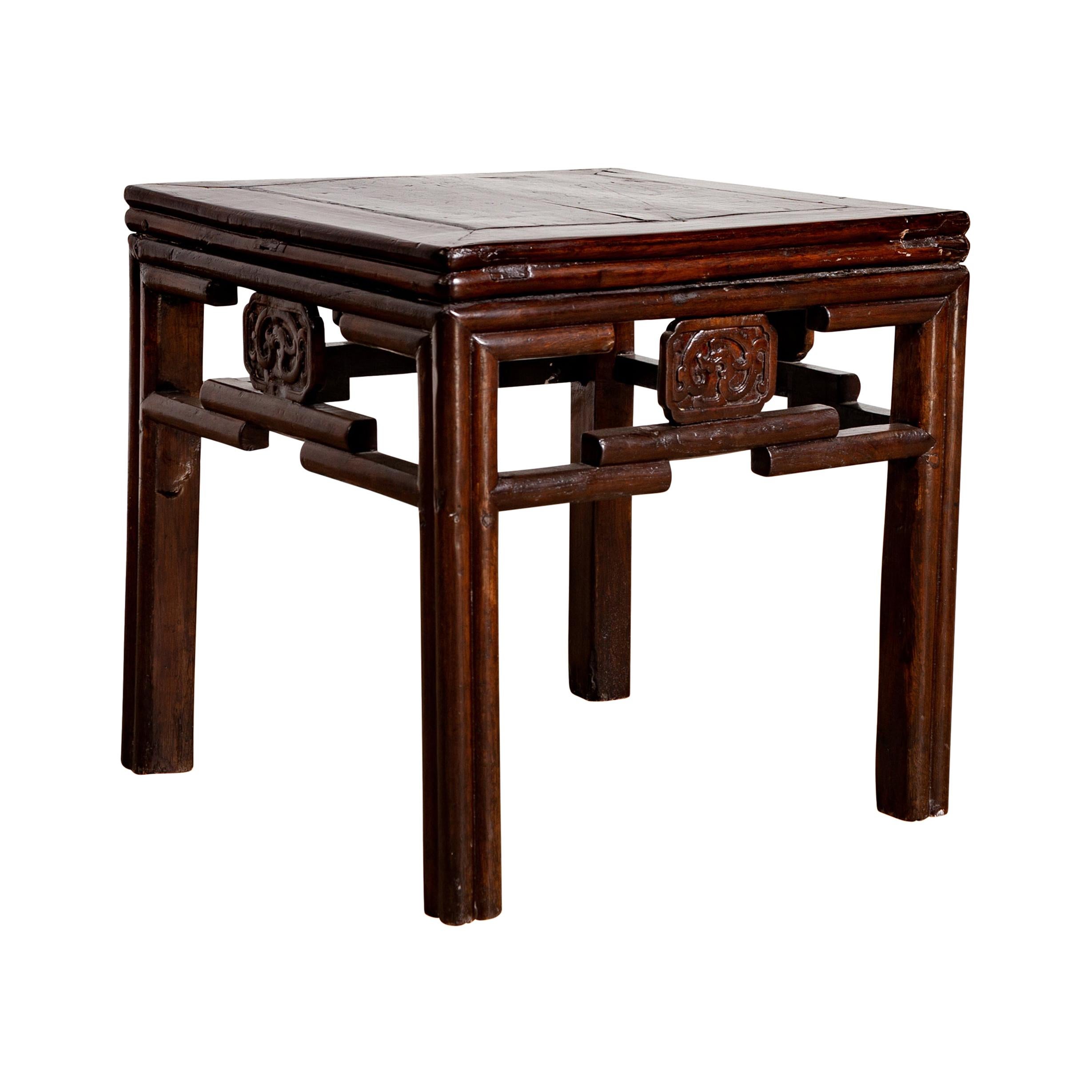 Chinese Vintage Qing Style Side Table with Dark Patina and Carved Medallions For Sale