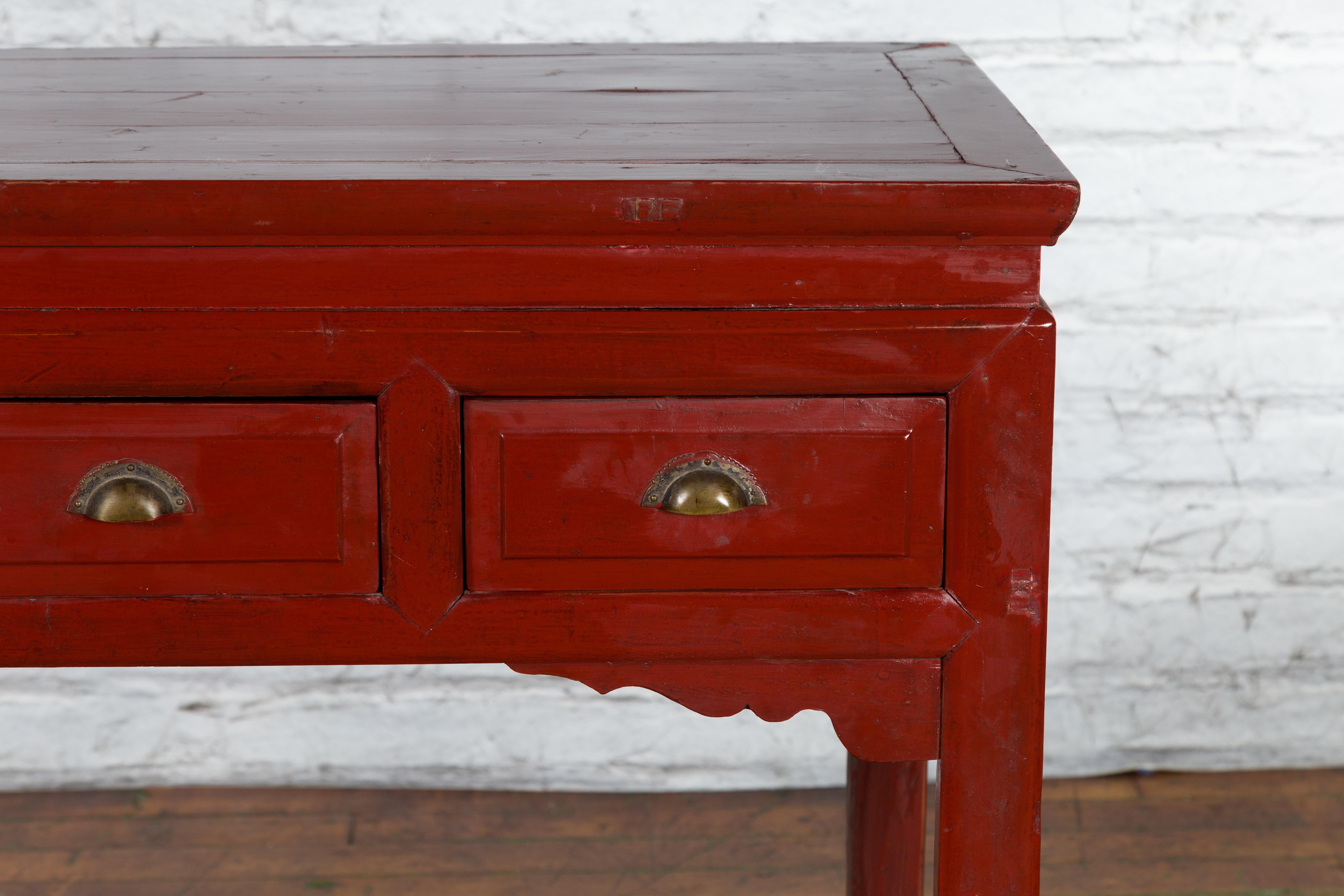 Lacquered Chinese Vintage Red Lacquer Console Table with Drawers and Carved Spandrels For Sale