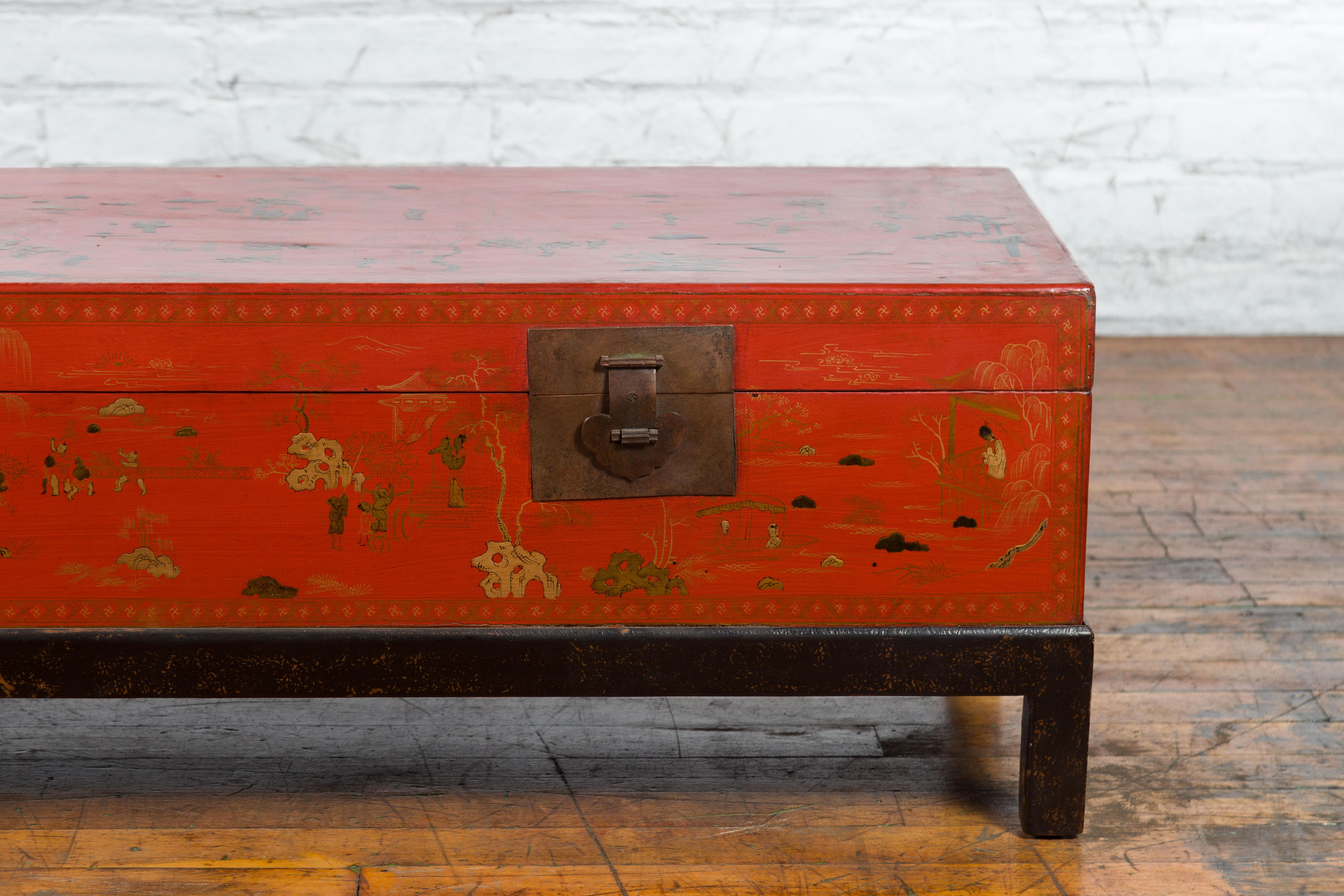 Chinese Vintage Red Lacquered Trunk on Black Base with Gilded Chinoiserie Décor 1