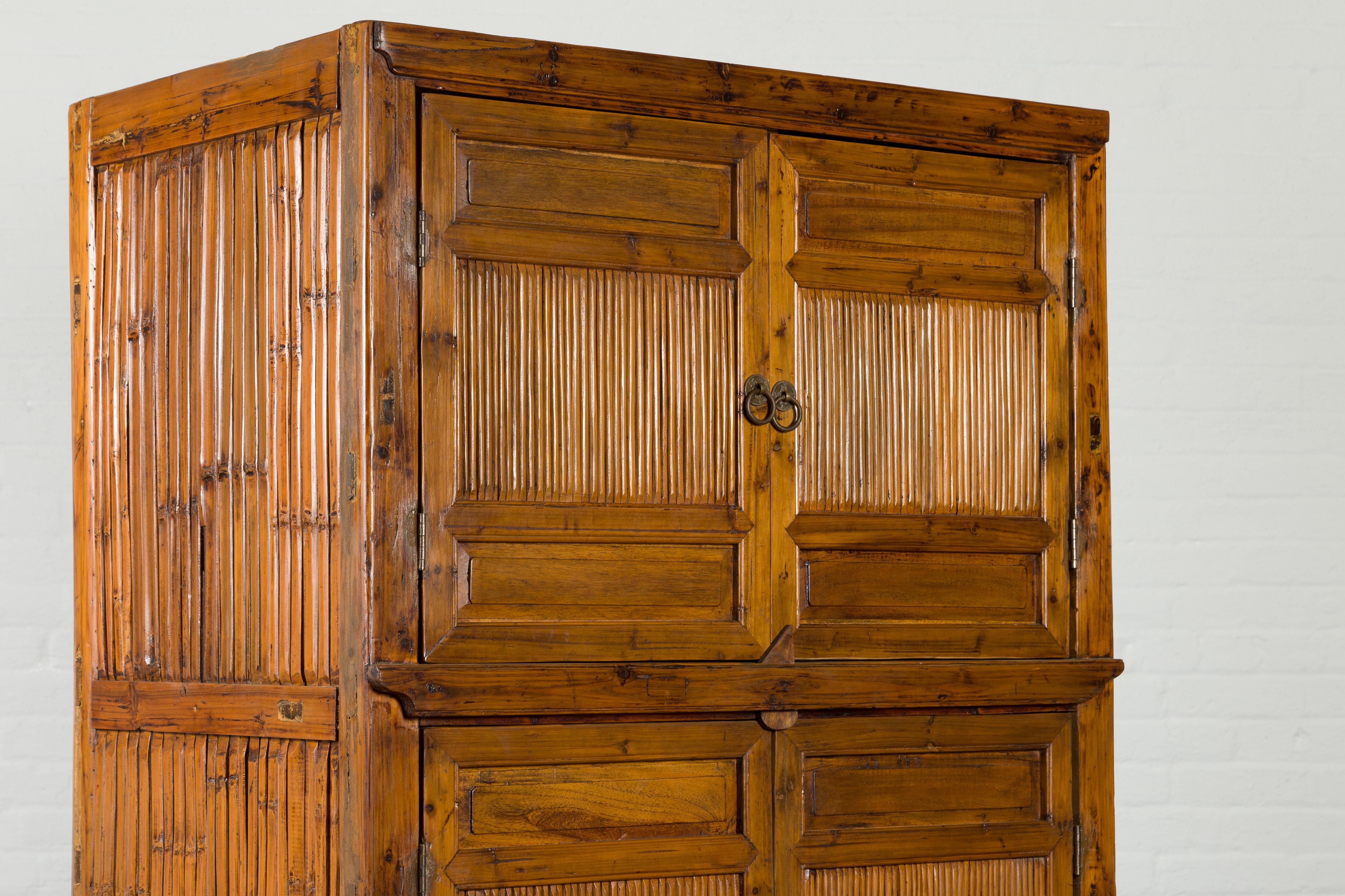 Chinese Vintage Wood and Bamboo Cabinet with Double Doors and Openwork Apron For Sale 4