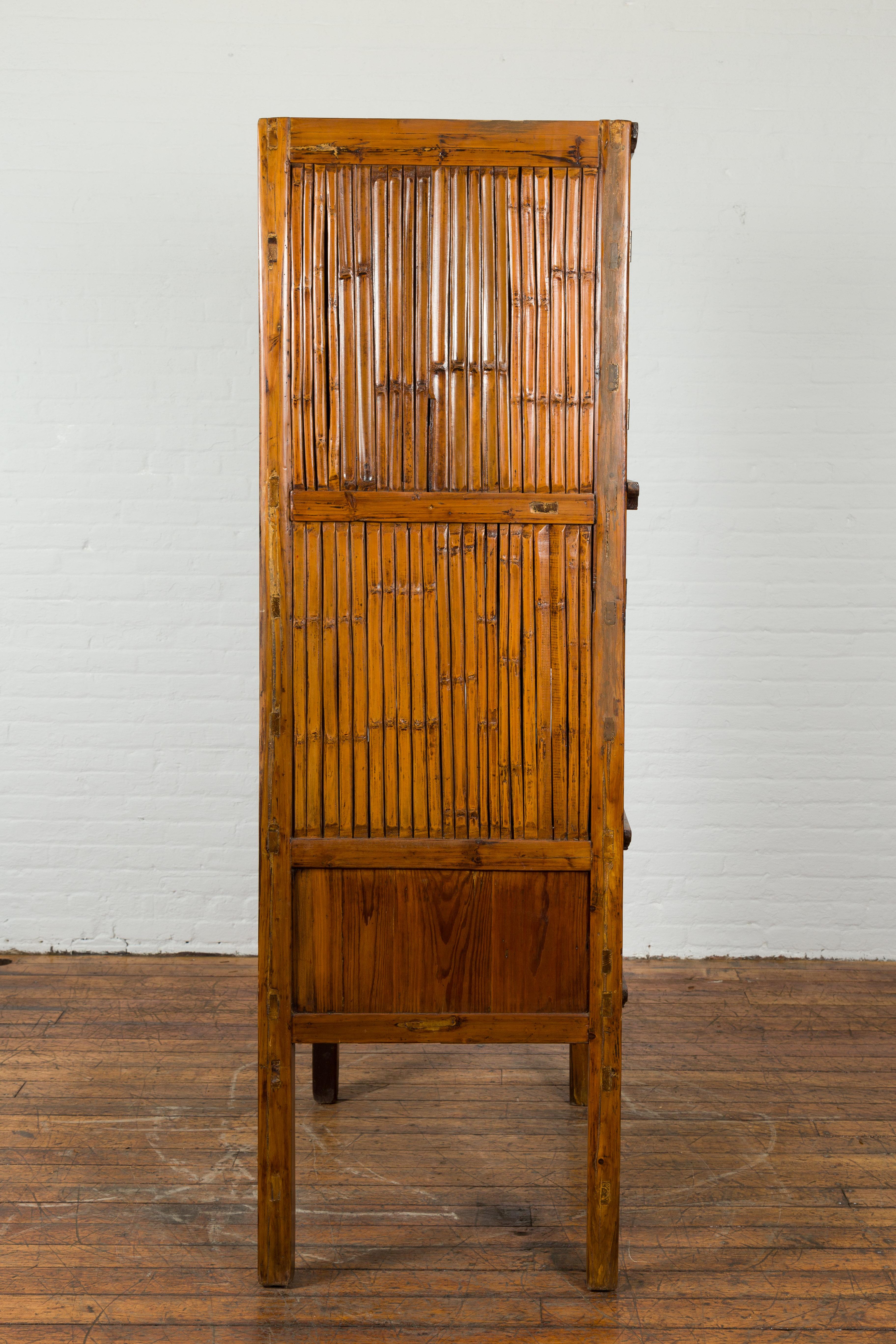 Chinese Vintage Wood and Bamboo Cabinet with Double Doors and Openwork Apron For Sale 5