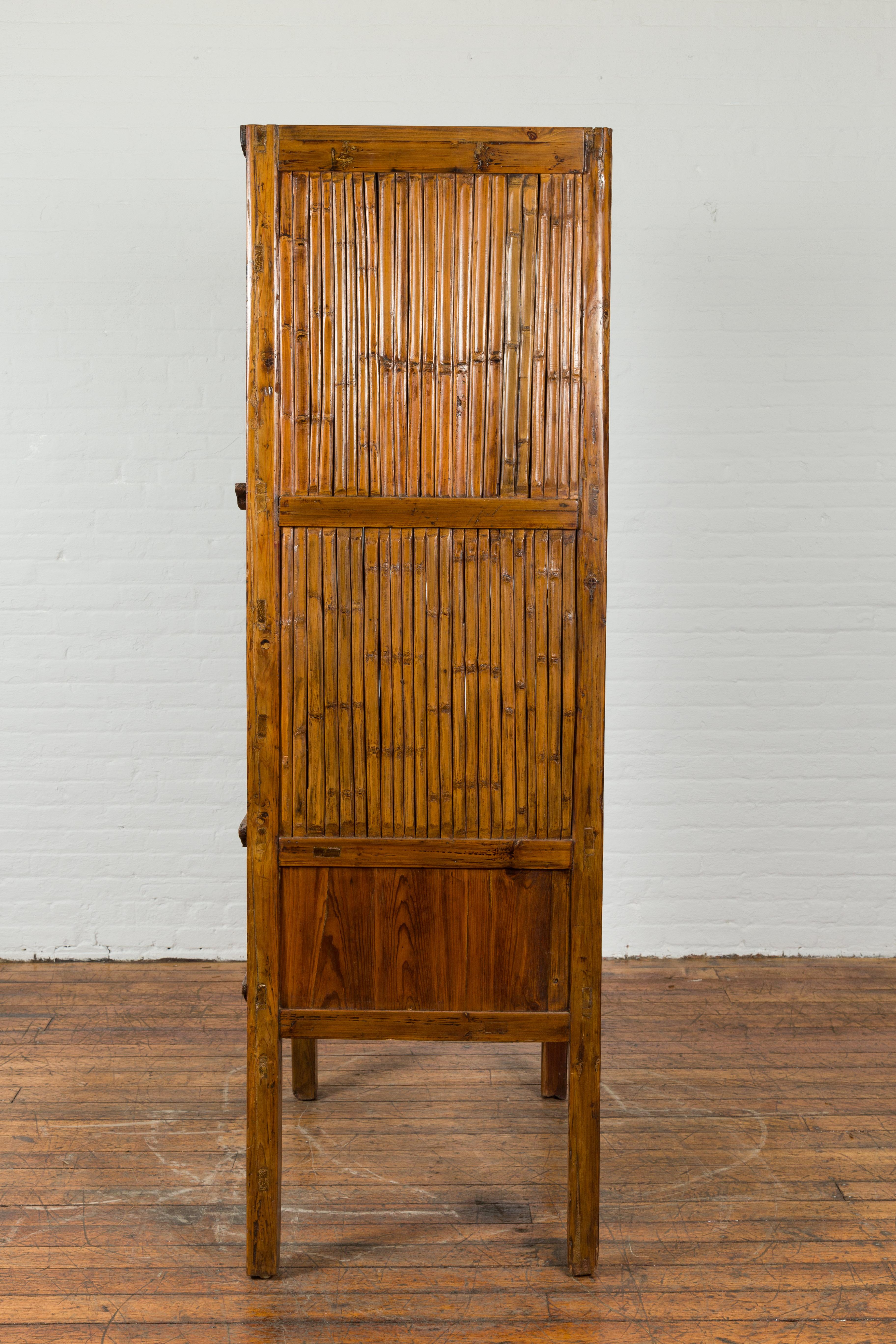 Chinese Vintage Wood and Bamboo Cabinet with Double Doors and Openwork Apron For Sale 7