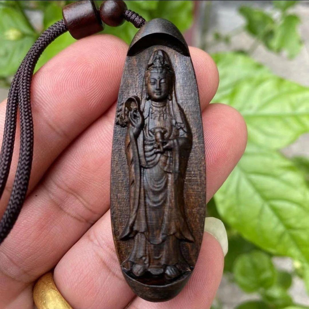 This Old Chinese Wood Carving Standing Buddha Statue Pendent is a significant artifact that combines artistic craftsmanship with profound spiritual symbolism. 

The standing posture of the Buddha represents readiness and active engagement with the