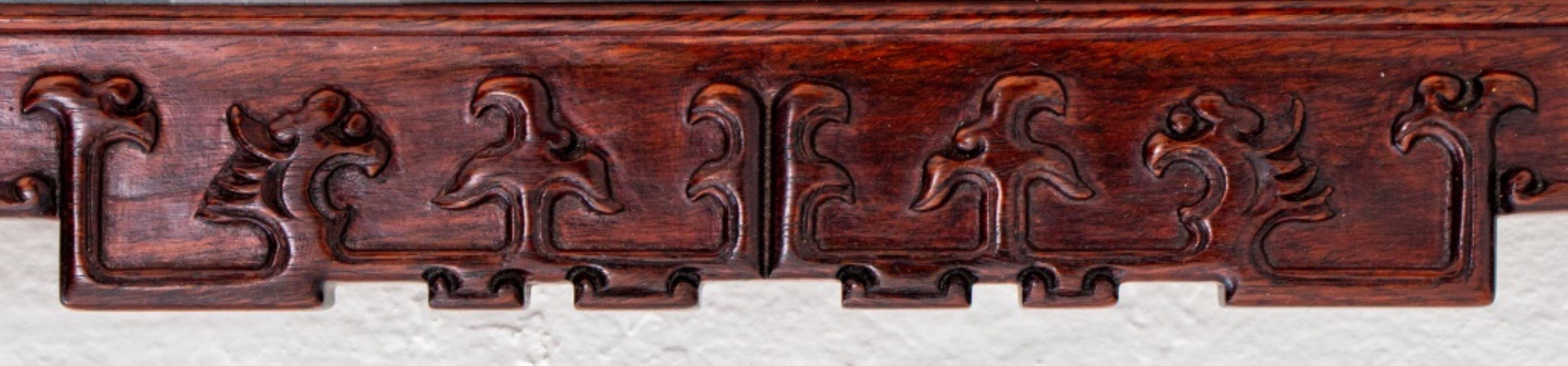 Chinese hardwood wall-mounted snuff bottle vitrine display cabinet, rectangular with geometric Chinese cloud motifs at top and bottom, the interior fitted with fretwork shelves. 24