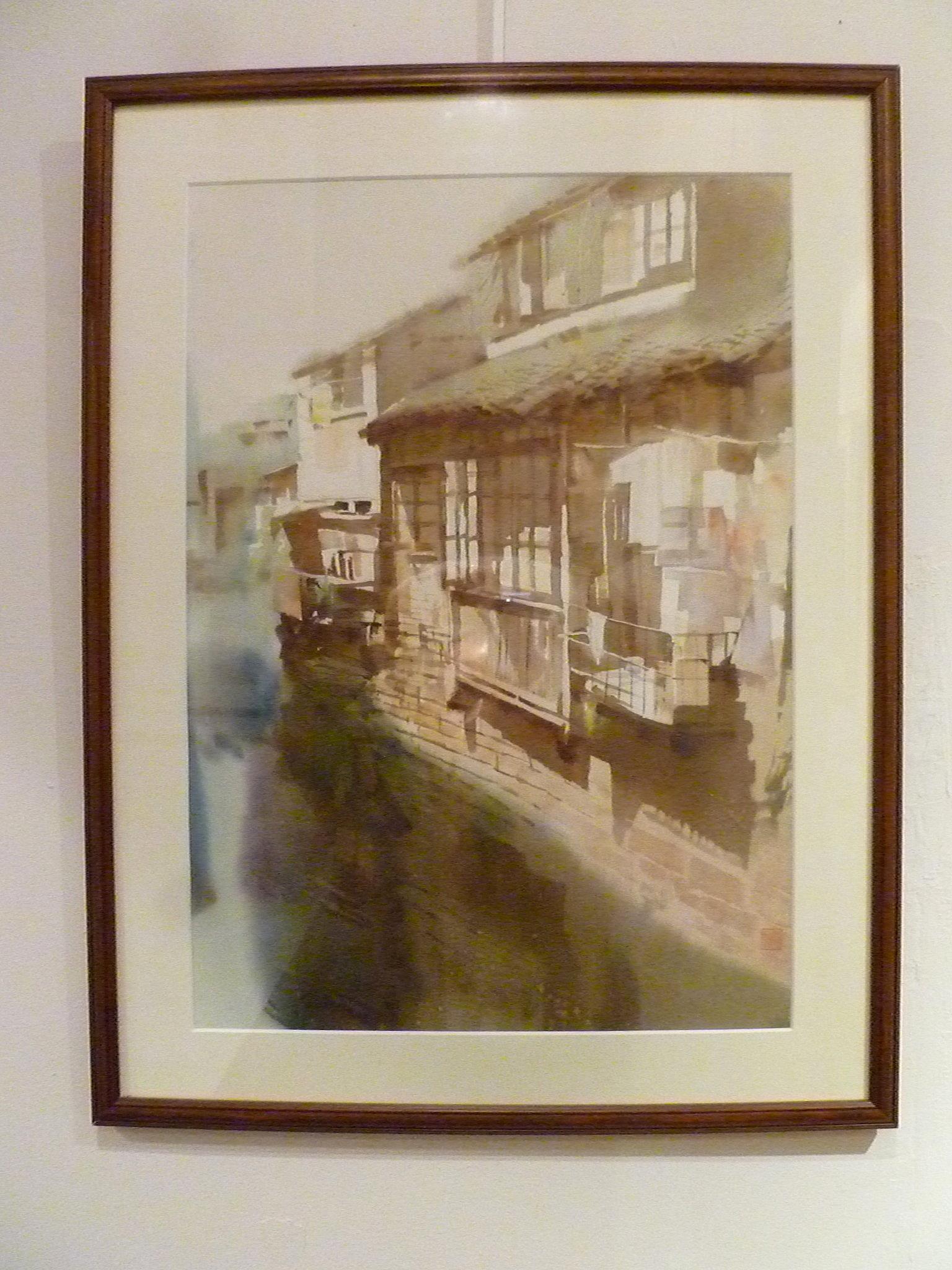 Framed Chinese water color of riverside village with one artist seal.
Overall size: 19.5 width 26