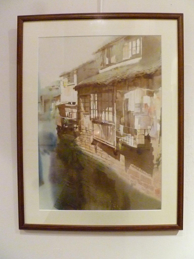 Framed Chinese water color of riverside village with one artist seal.
Overall size: 19.5 width 26