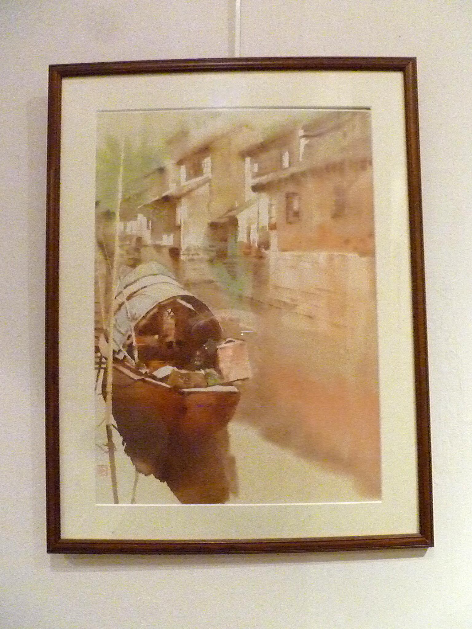 Framed Chinese water color of riverside village with boat with one artist seal.
Overall size: 19.5 width, 26