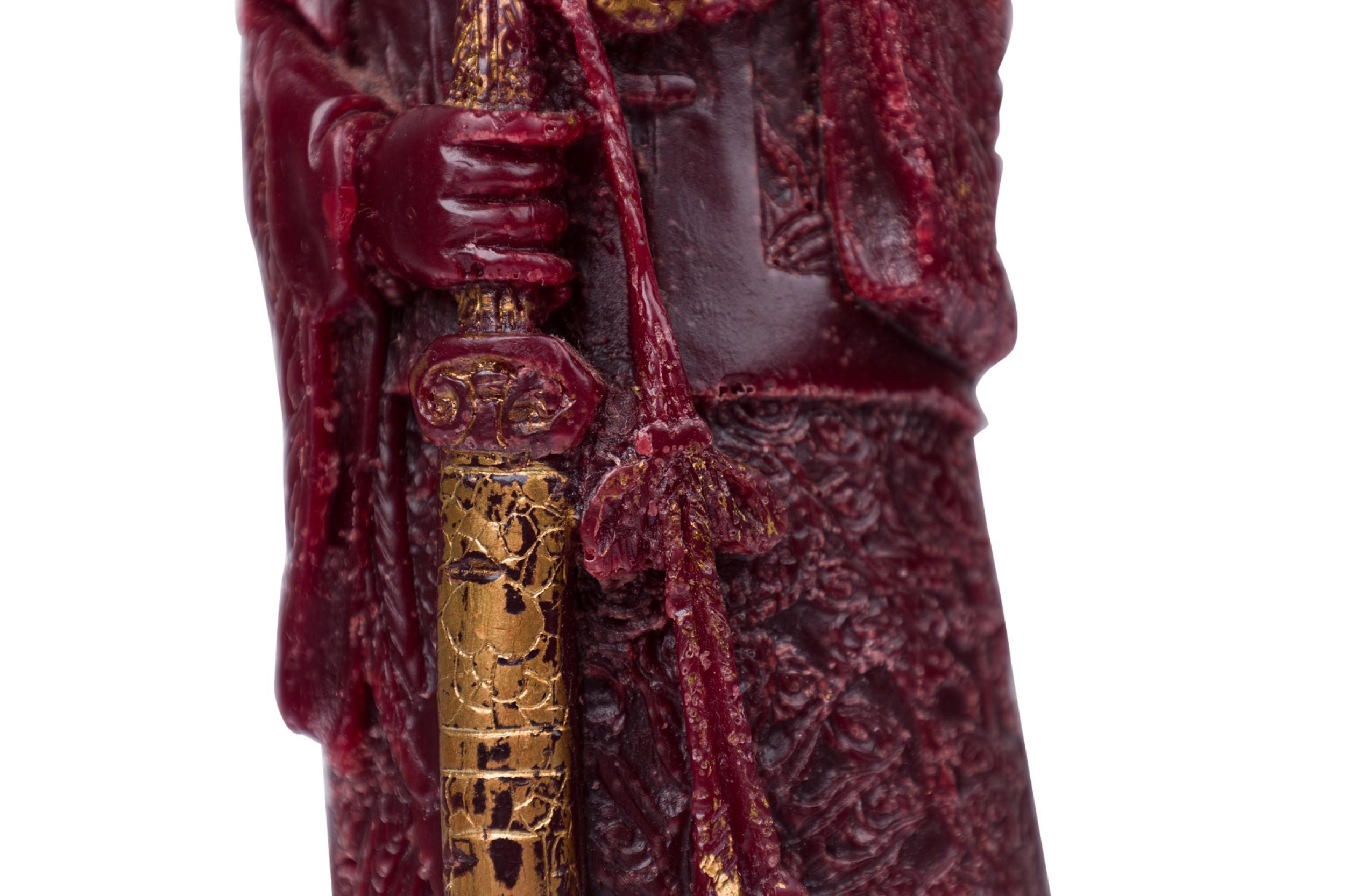 Chinese wax figure molded in a reddish-brown shade with gilt highlights depicts a robed emperor leaning slightly back, his left hand stroking his beard, right arm grasping a sheathed sword with hanging sash.
 

 Some wear and gilt losses
