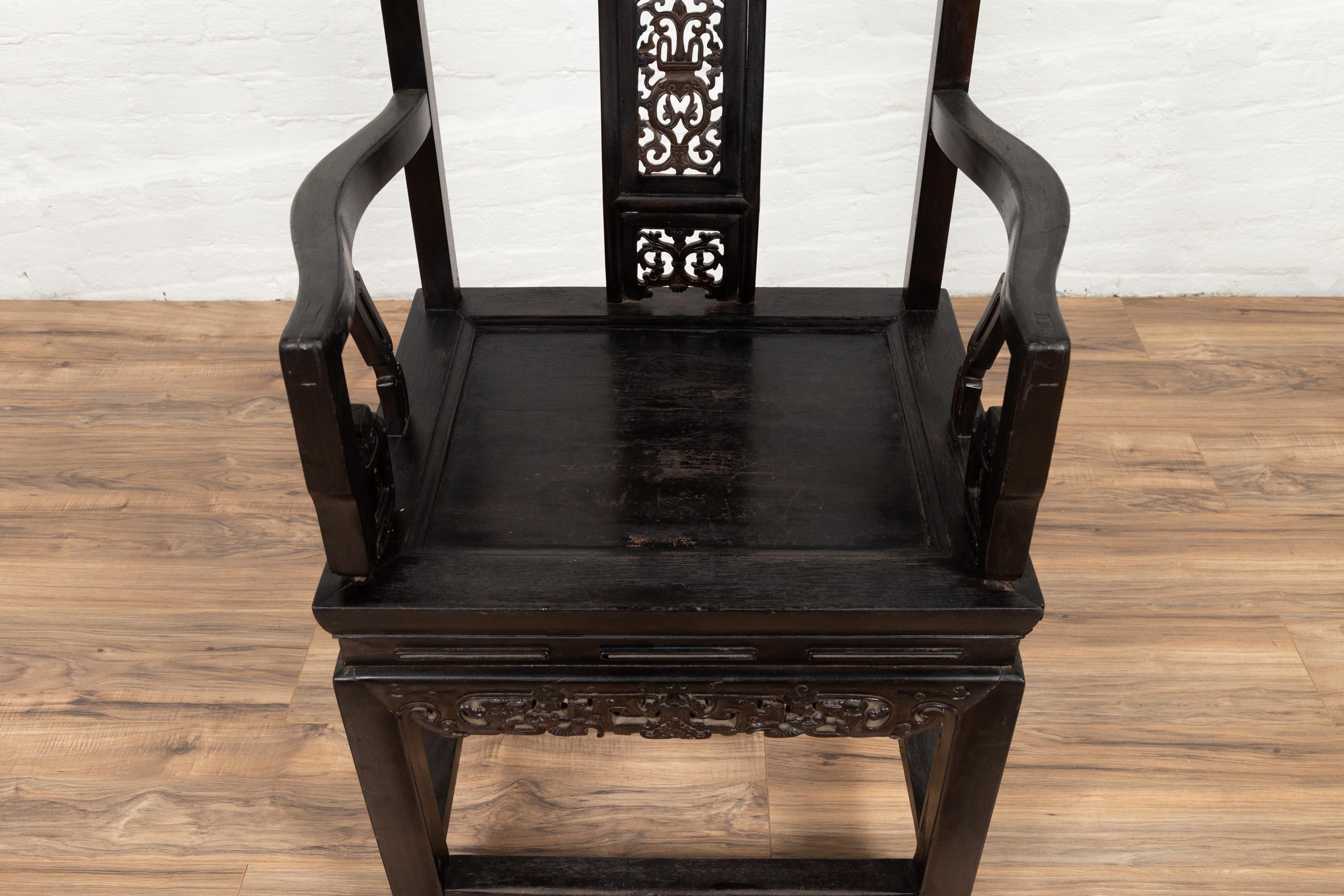 Wood Chinese Wedding Chair with Curvy Pierced Splat, Serpentine Arms and Dark Patina For Sale