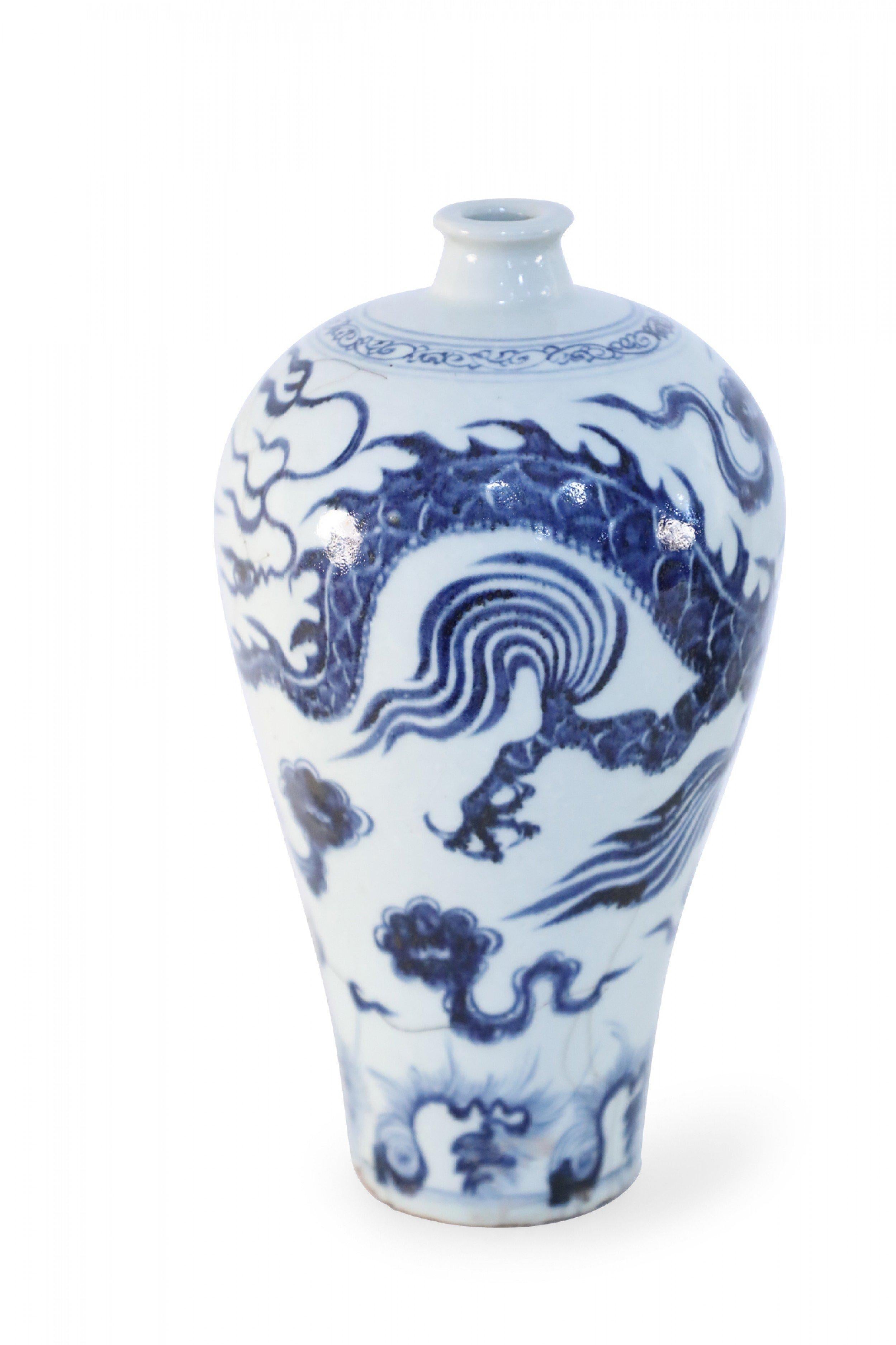 Antique Chinese (Late 17th century-style) white porcelain Meiping vase decorated in a dynamic blue dragon motif.
    