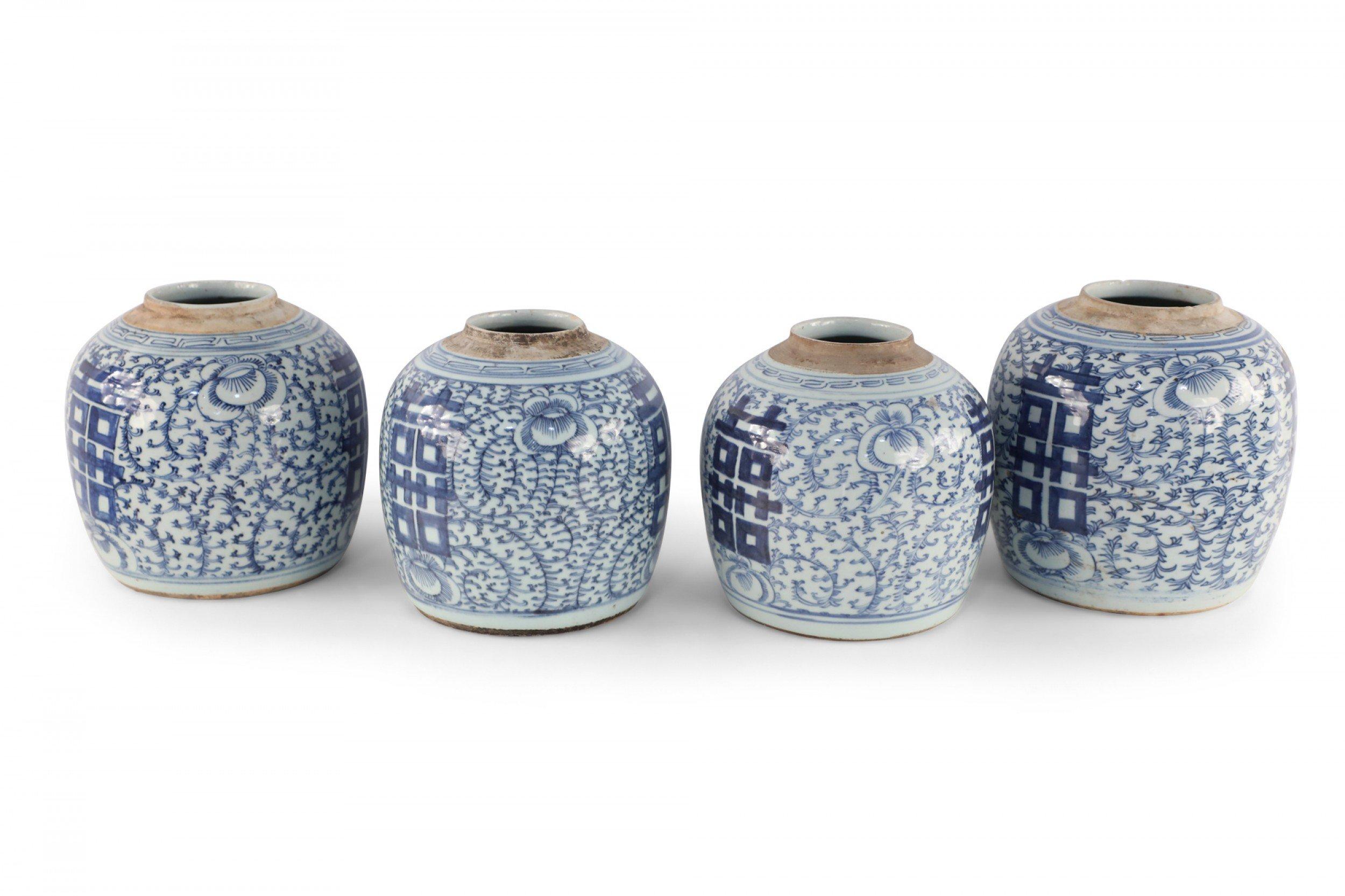 5 antique Chinese (Early 20th Century) similar porcelain ginger jars with blue floral designs around bold, centered characters and geometric bands leading to unglazed rims (jars vary slightly in size, pattern, and color) (Priced each).
 