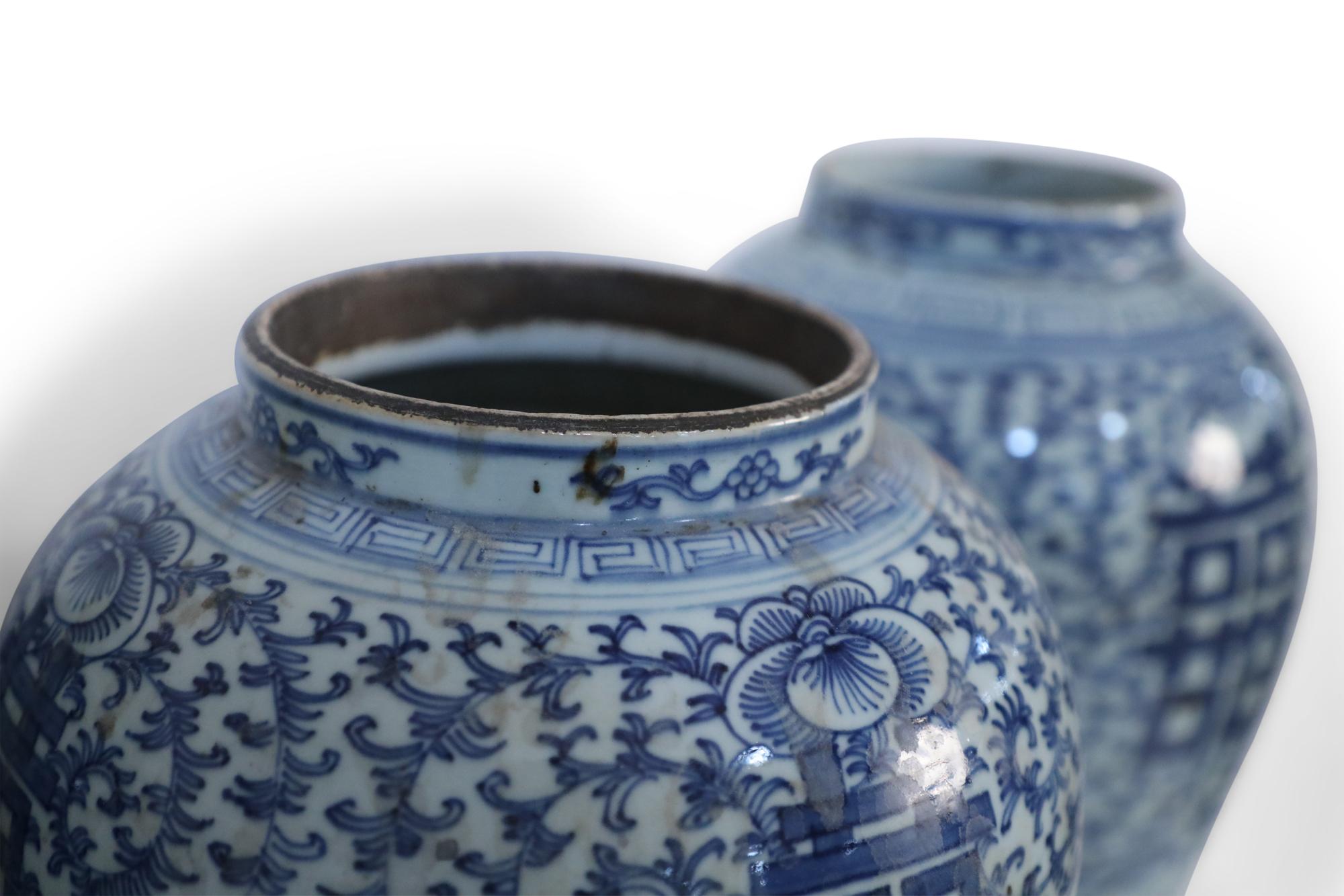 Chinese White and Blue Floral Lidded Urns 1