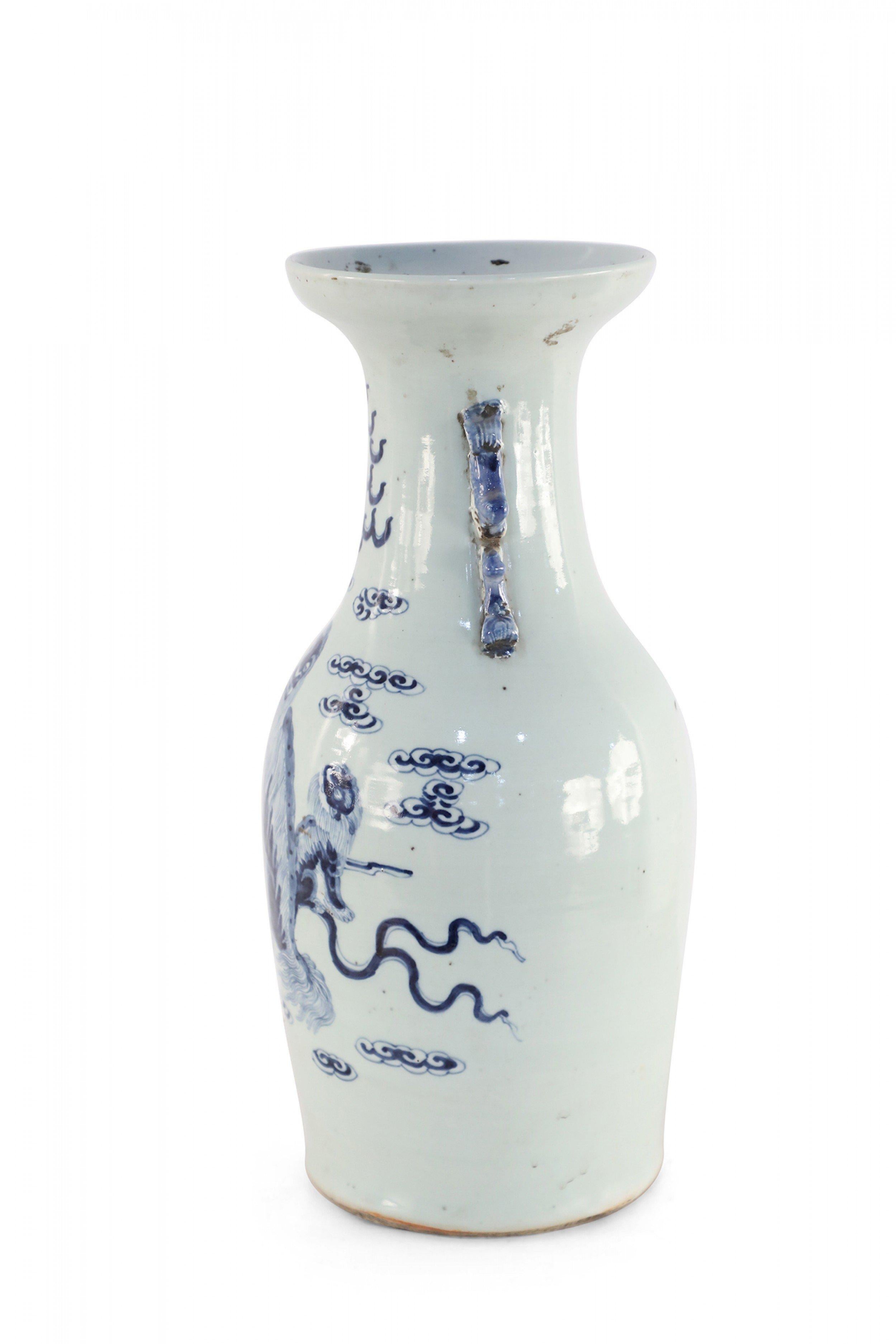 Chinese Export Chinese White and Blue Foo Dog and Serpent Design Porcelain Urn For Sale