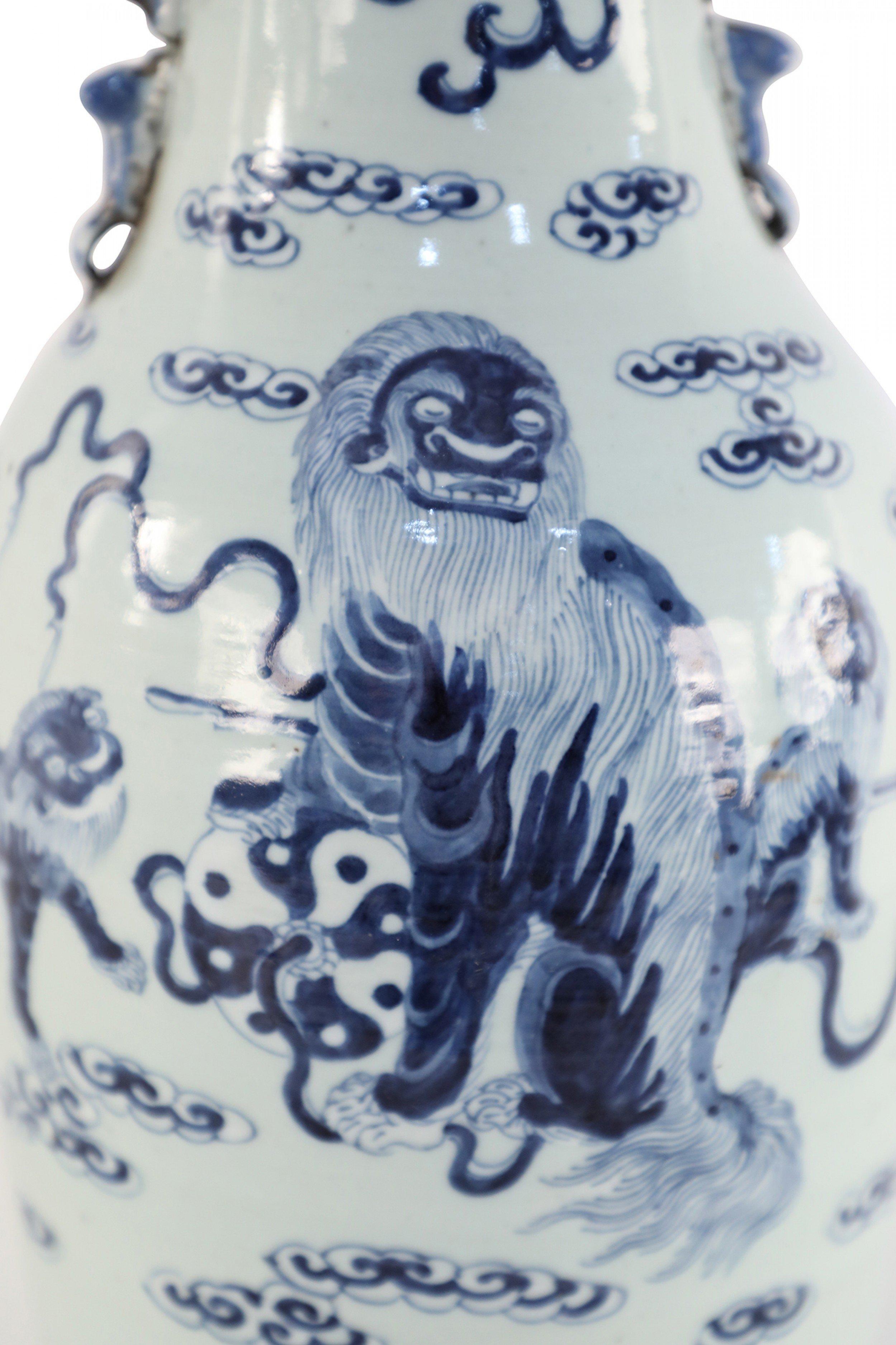 Chinese White and Blue Foo Dog and Serpent Design Porcelain Urn In Good Condition For Sale In New York, NY