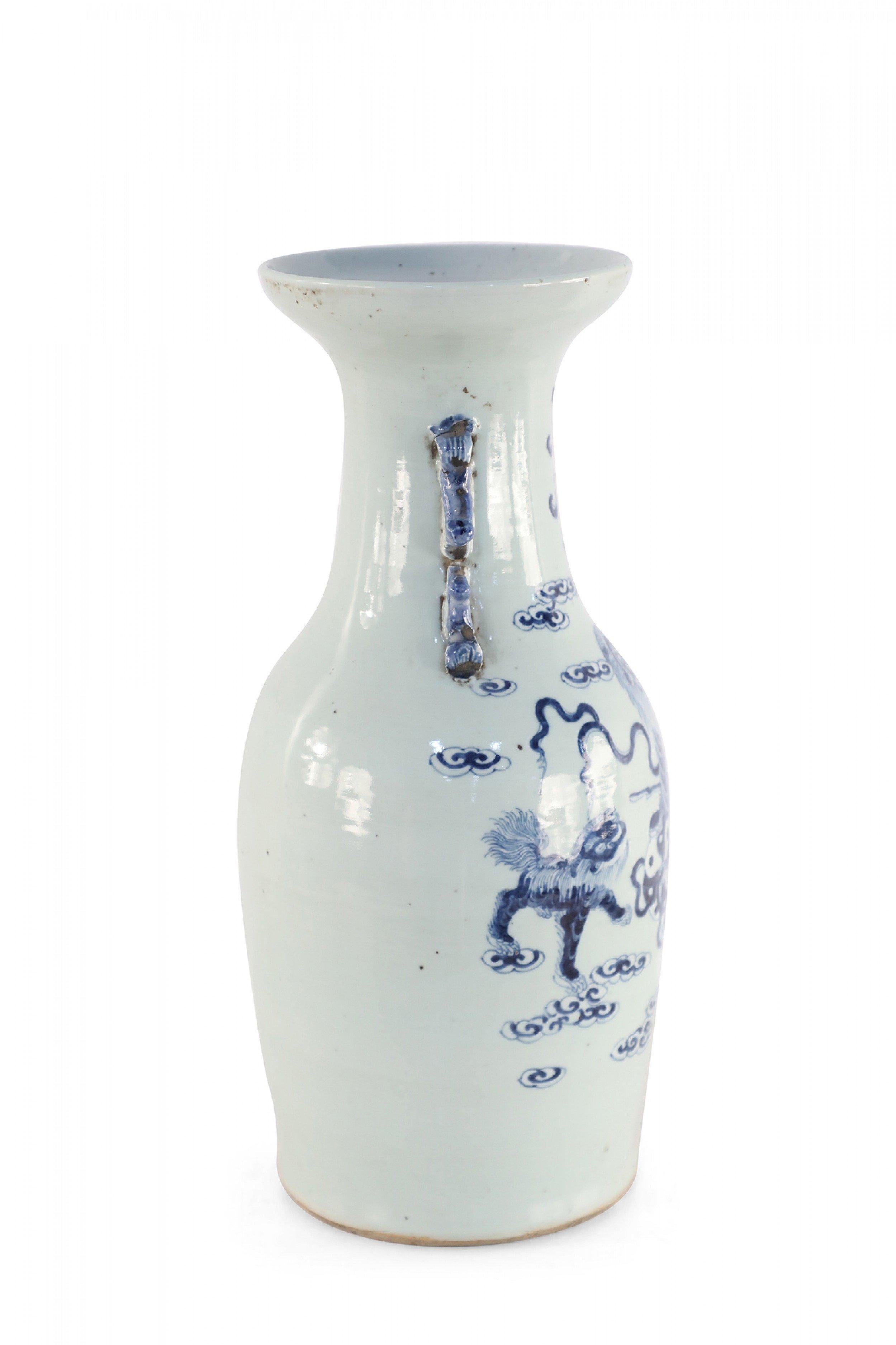 19th Century Chinese White and Blue Foo Dog and Serpent Design Porcelain Urn For Sale
