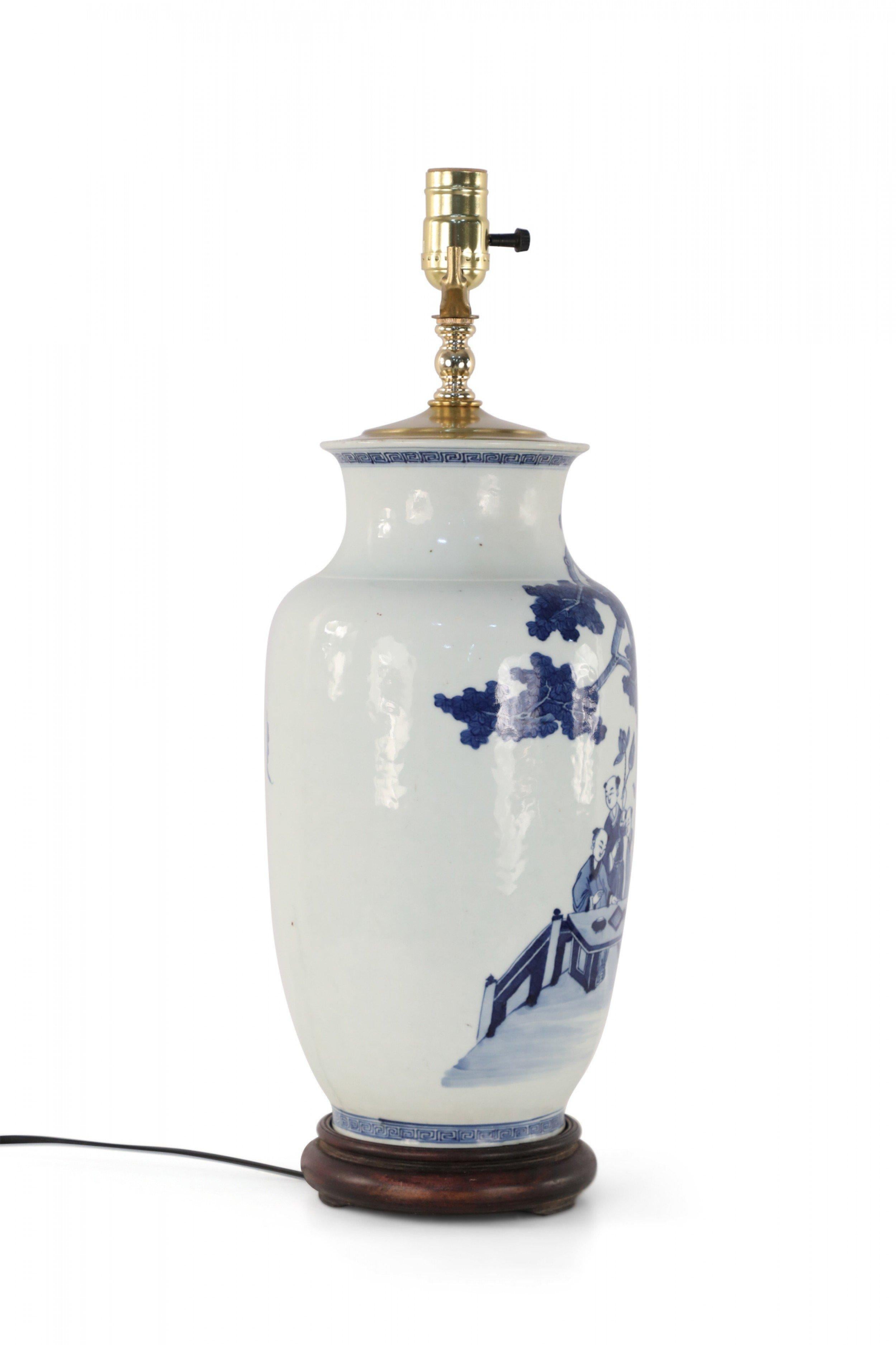 Chinese Export Chinese White and Blue Gaming Scene Table Lamp For Sale