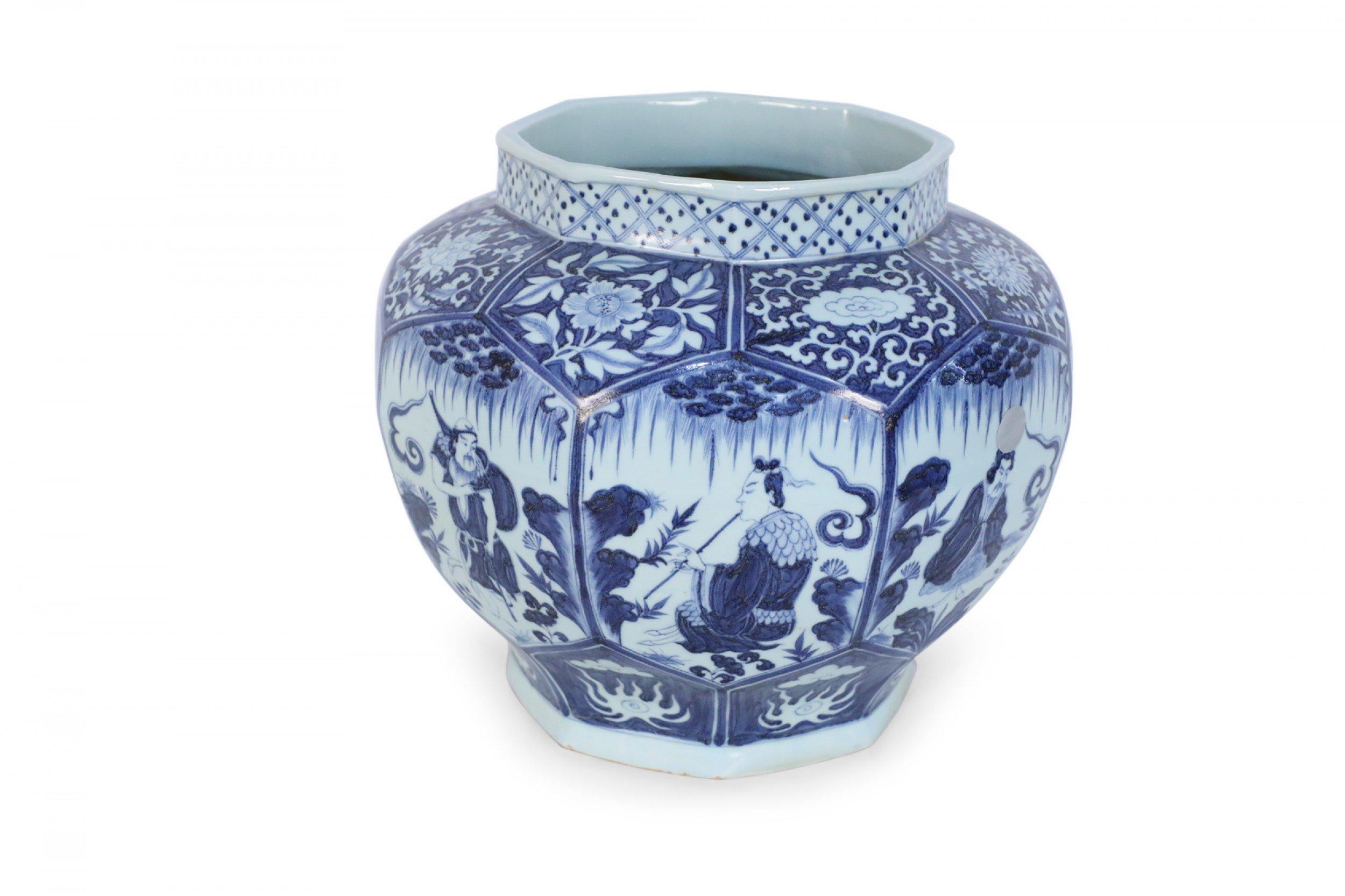 Chinese white and blue porcelain octagonal pot painted with a unique figurative vignette in each panel beneath a floral design leading up to the opening.
 