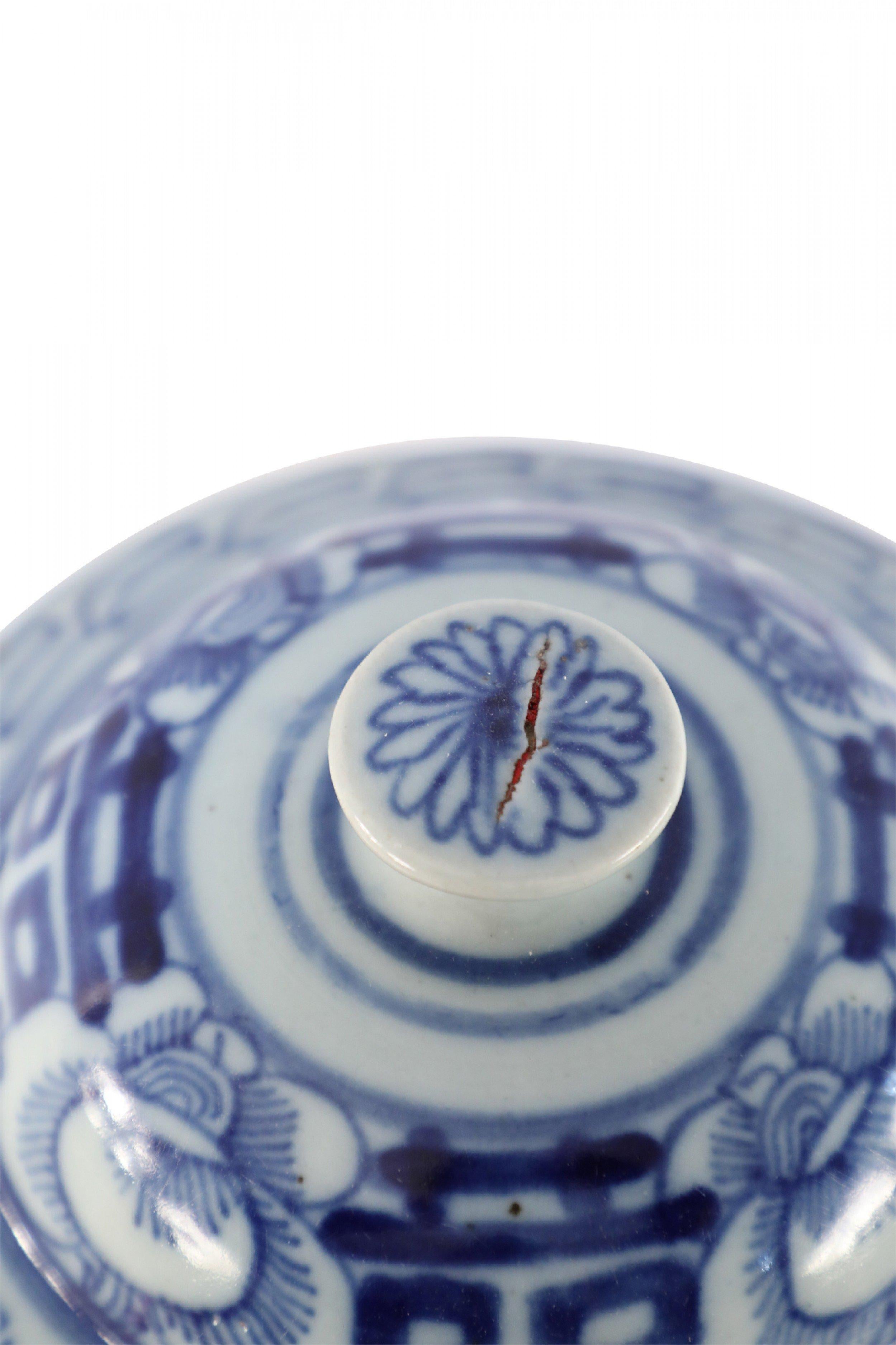 3 similar antique Chinese (Early 20th Century) lidded porcelain ginger jars with dark blue vine and floral motifs against white backgrounds, Greek key patterns around the necks, and bold blue characters on 4 sides and the lid (priced each).
   