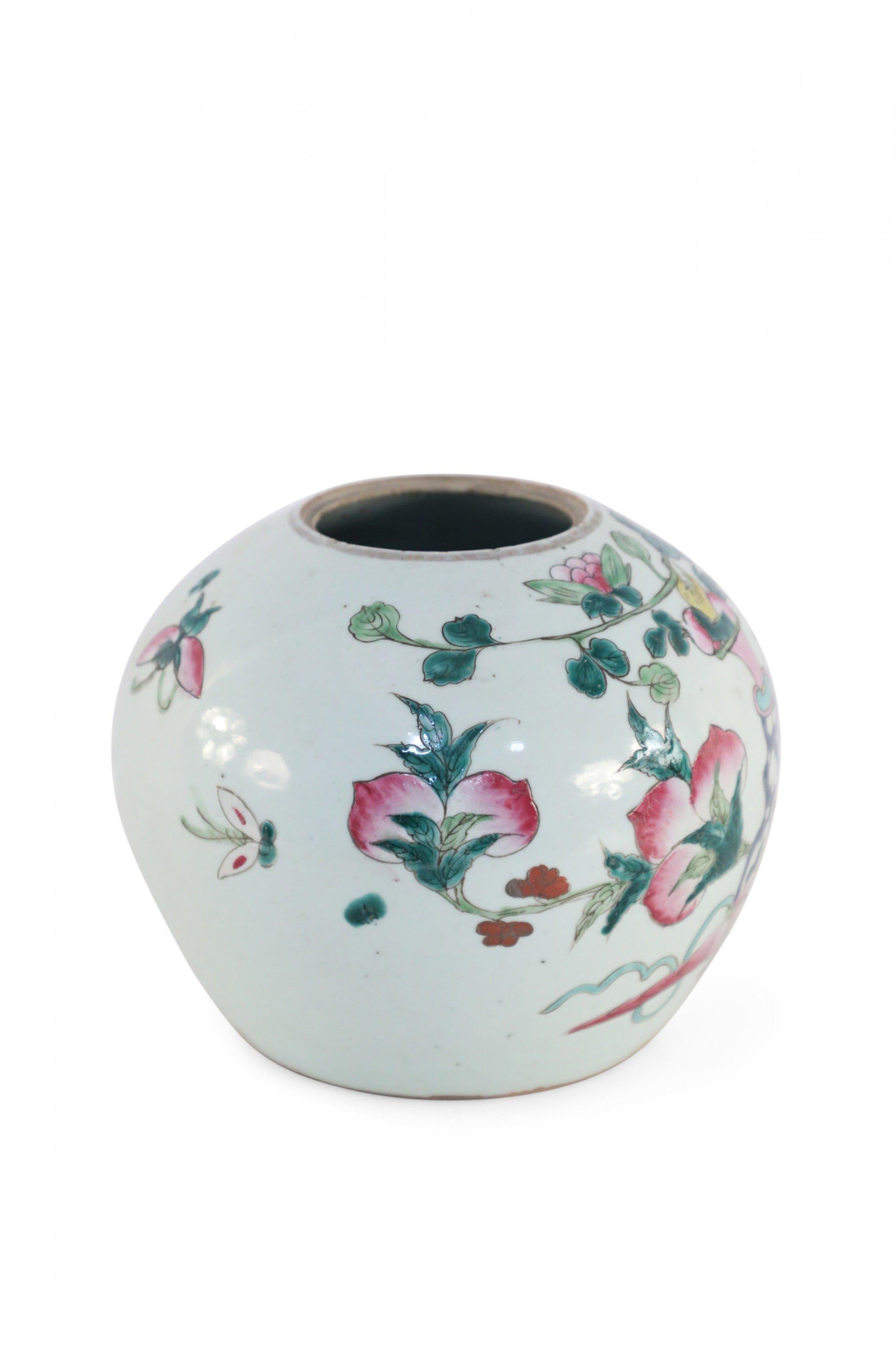 Antique Chinese (Early 20th Century) low, rounded porcelain vase, known as a watermelon jar, incised and painted with an array of decorations including floral arrangements in urns, bells, small furnishings and butterflies.
 