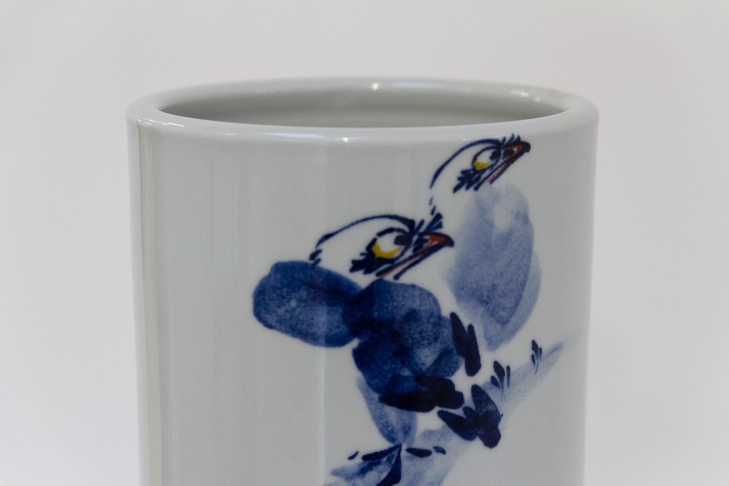 Chinese White, Blue and Red Cylindrical Porcelain Vase, 1970s.

Tall ceramic glazed and hand painted Chinese vase with floral and birds motifs and decorative Chinese calligraphy in different shades of blue. 

Large and very elegant proportions,