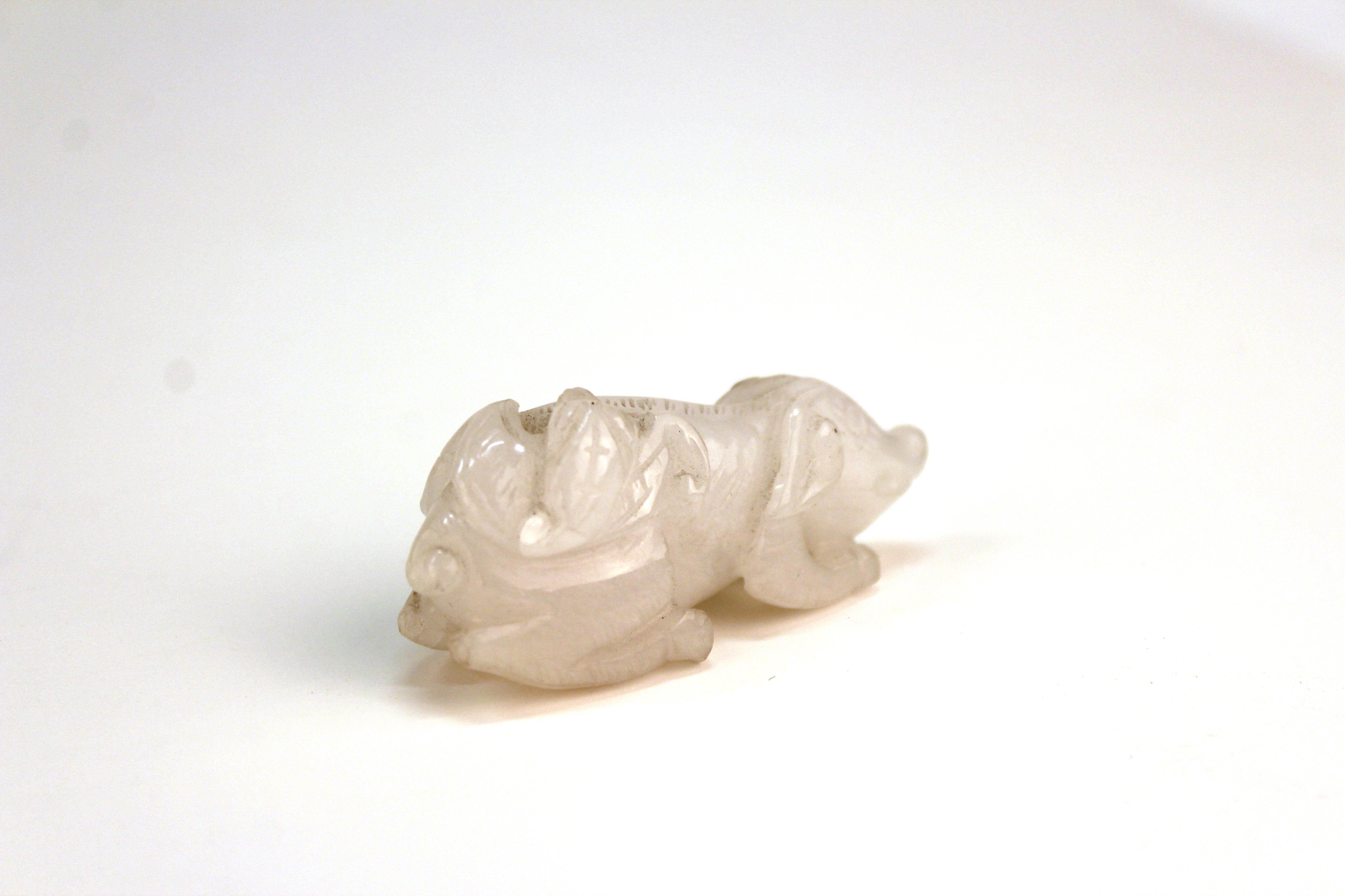 Chinese diminutive sculpture of a small pig with a bat sitting on its back, carved in white jadeite. Can also be worn as an amulet. In good vintage condition.