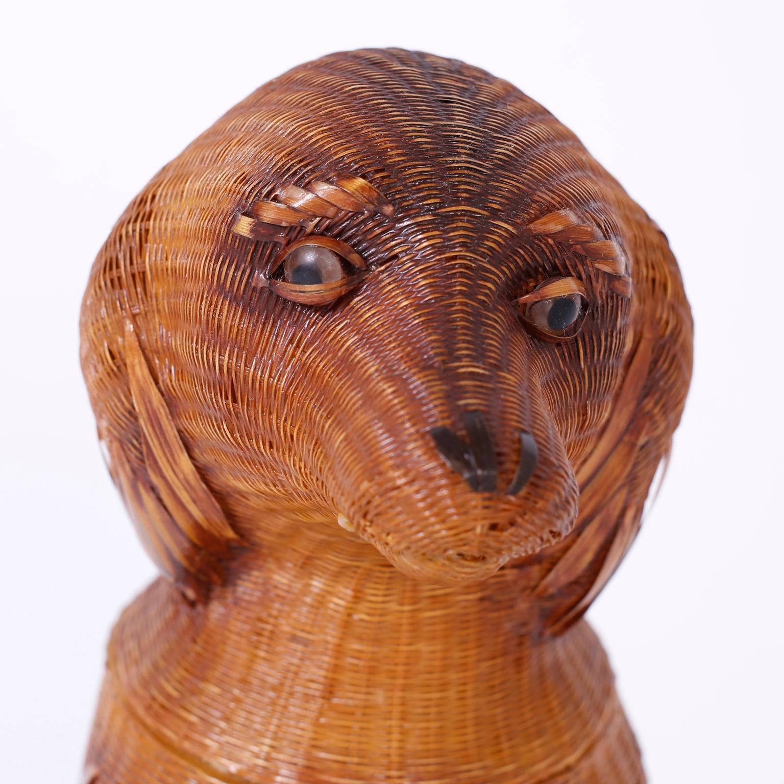 From the famed Shanghai collection, a midcentury puppy crafted in wicker and reed with a removable lid and plenty of decorative appeal.