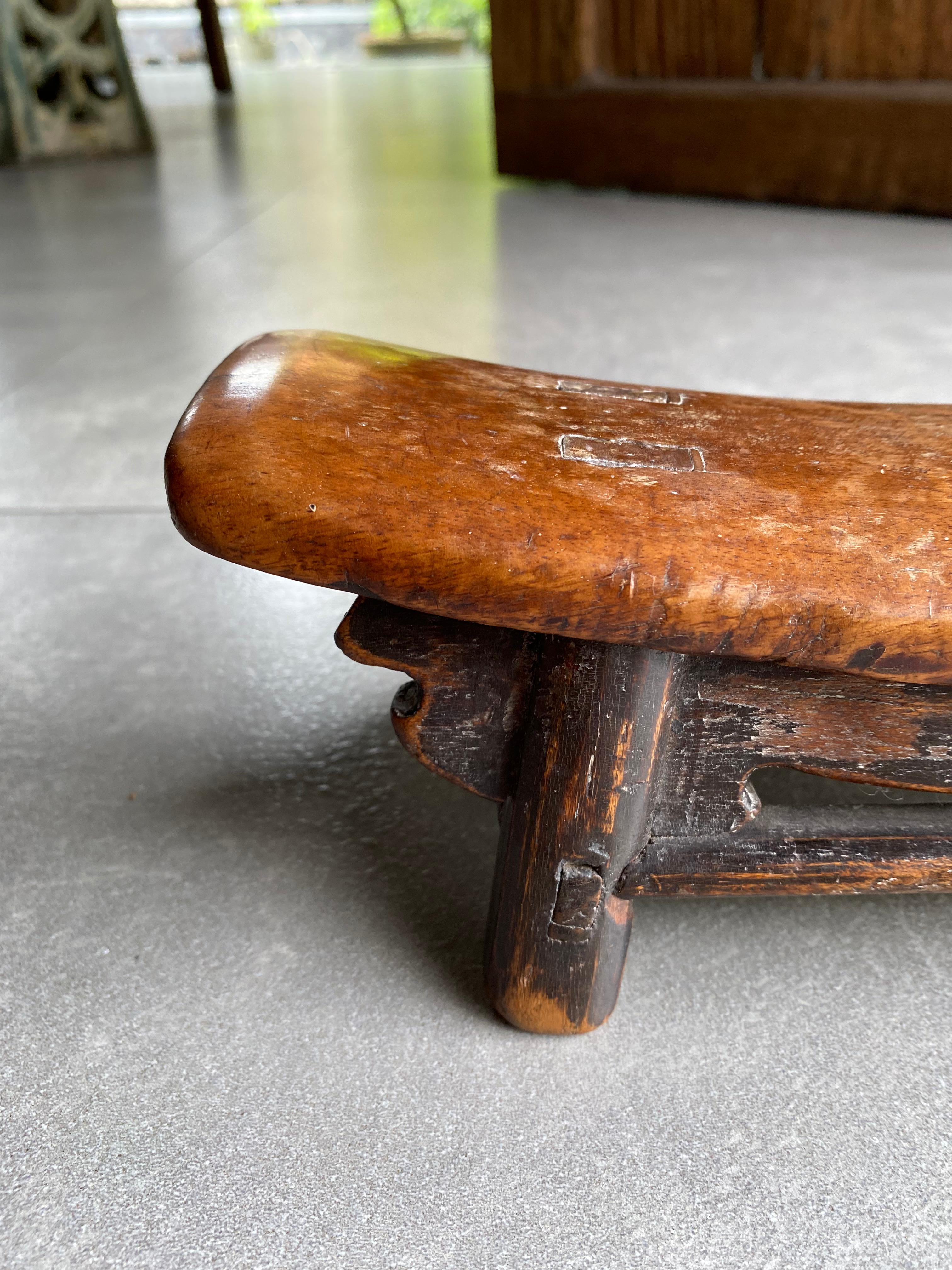 Hand-Carved Chinese Wooden Opium Headrest from Early 20th Century