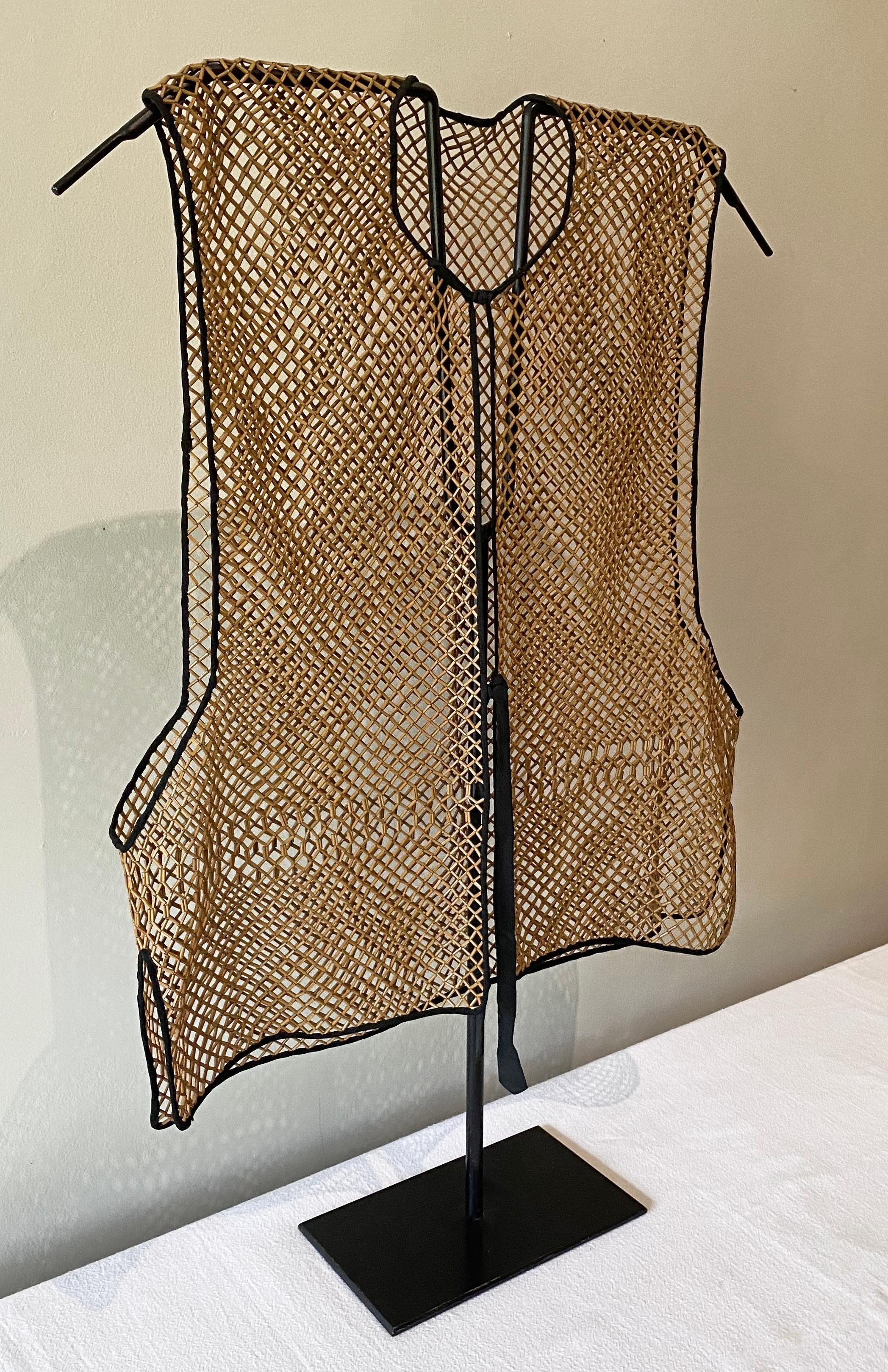 This bamboo vest from the Qing Dynasty required exceptional skill to craft, using extremely thin bamboo shoots and a thin silk lining on the edges. It was worn as an undergarment for ventilation and protecting highly elaborate and expensive silk