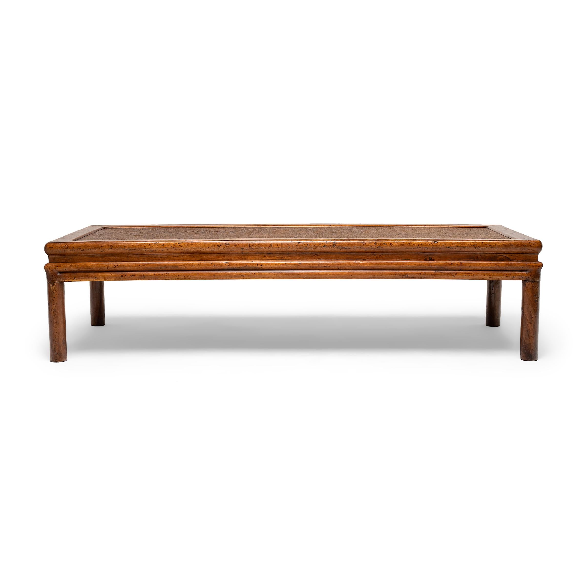 With exquisite joinery and balanced proportions, this woven-top summer daybed from Zhejiang province is a fine example of Qing-dynasty furniture. Dated to the mid-19th century, the low-lying daybed is a form of casual seating known as 